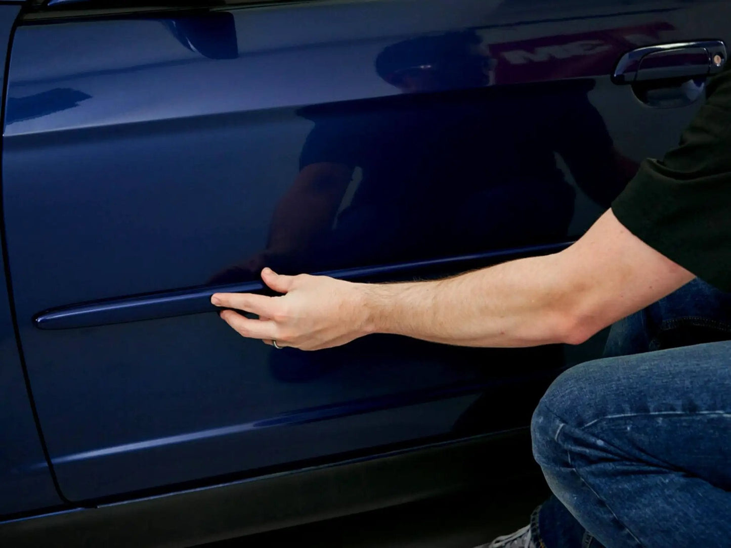 Applying Super-Strength Molding Tape 1/2 in x 15 ft Single Roll High-Strength Double-Sided Automotive Trim Adhesive to car door
