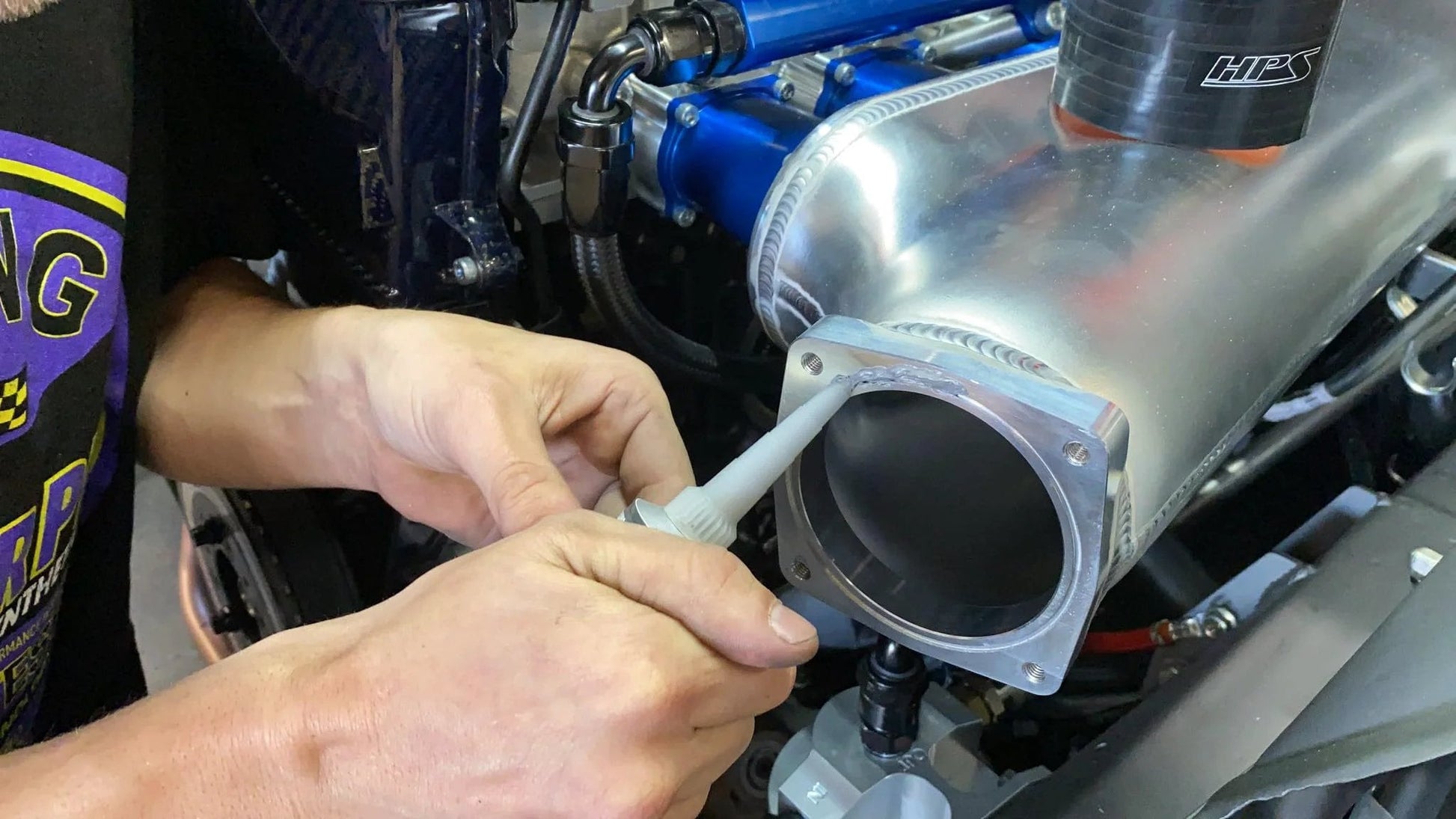 Applying High-Torque RTV Silicone Gasket Maker with Superior Vibration Resistance on engine component, 3.5 oz Permatex