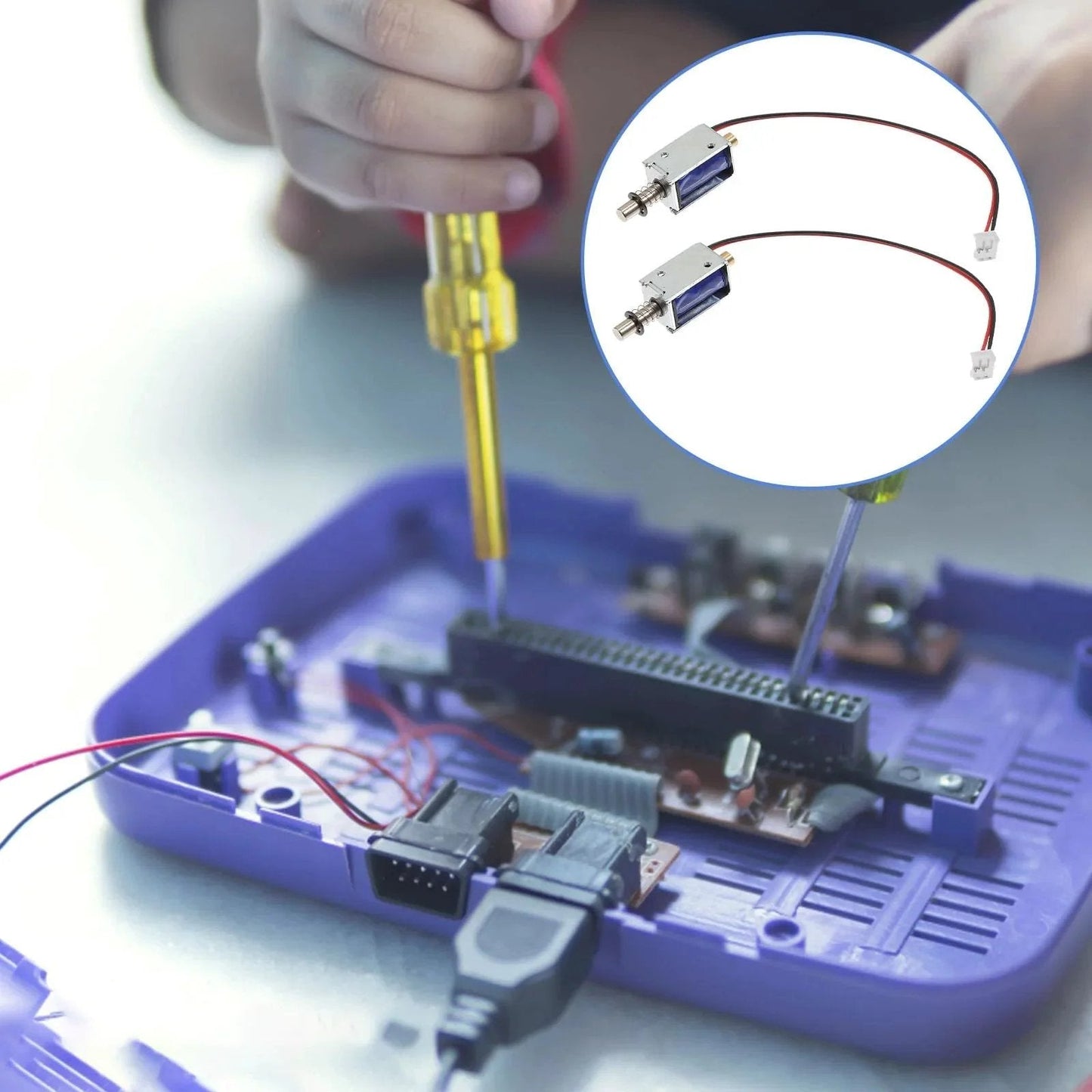 Mini Push Pull Solenoid Electromagnet 12V Open Frame Linear Actuator installed in a mechanical device, hands-on application scene