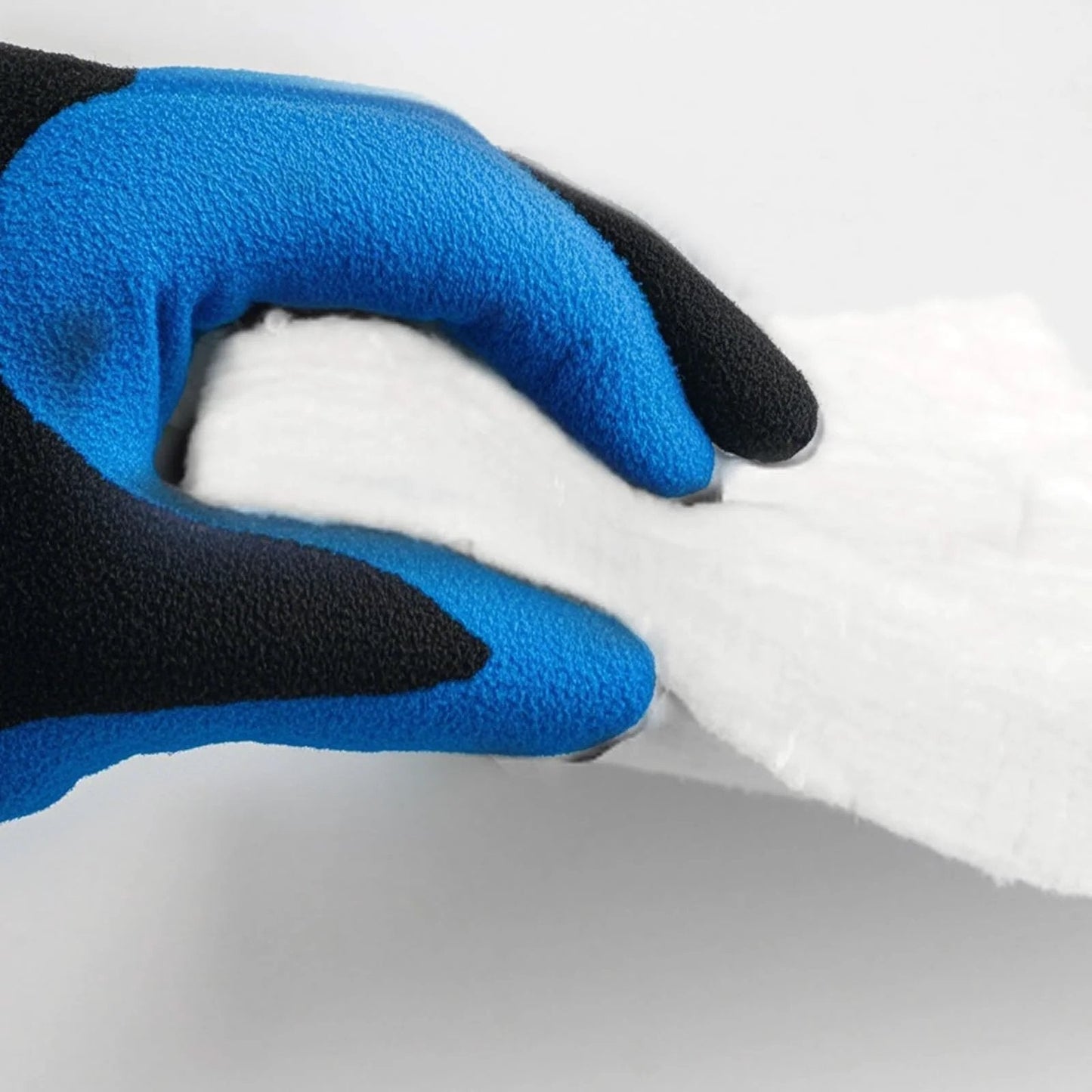 Gloved hand holding Ceramic Fiber Blanket Insulation For Fireproof Baffles And Wood Stoves 2400F High Temperature Resistance