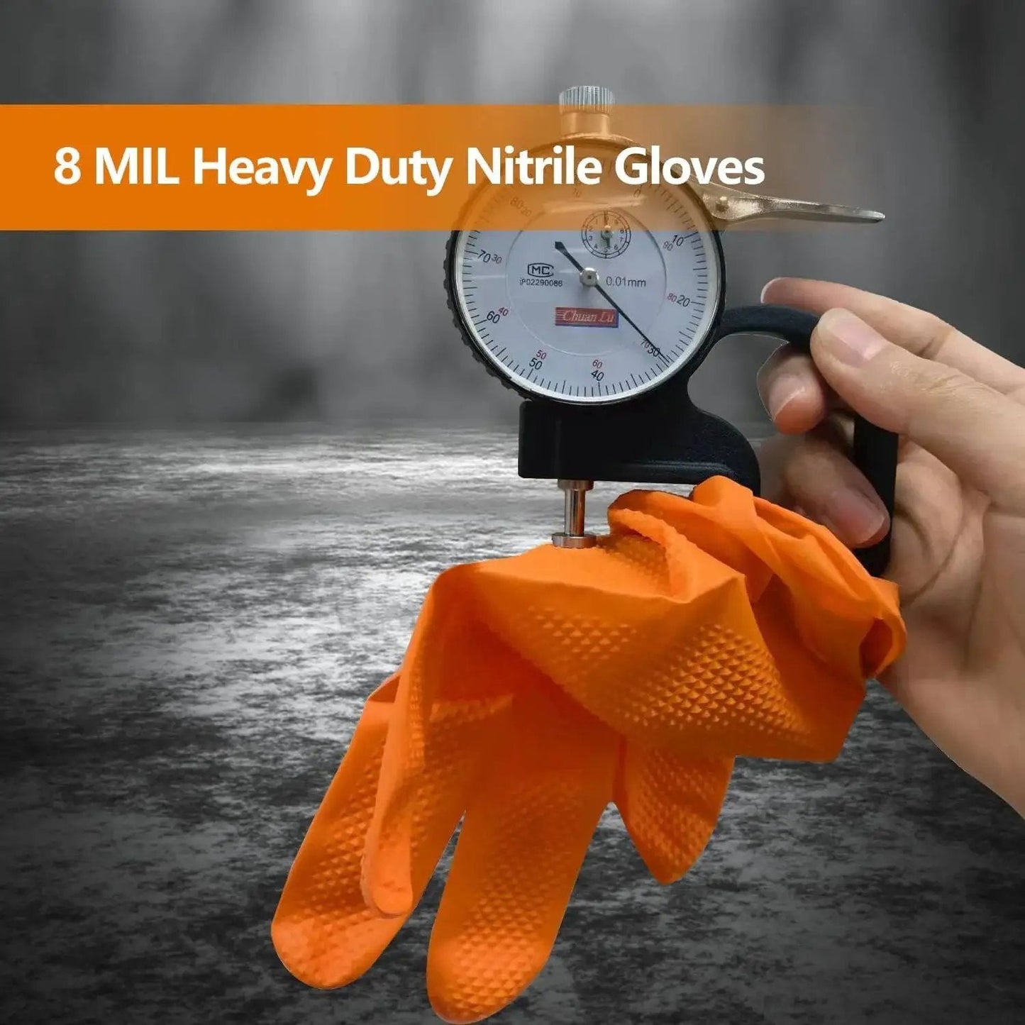8 mil heavy duty nitrile disposable gloves in orange diamond texture grip being measured for thickness