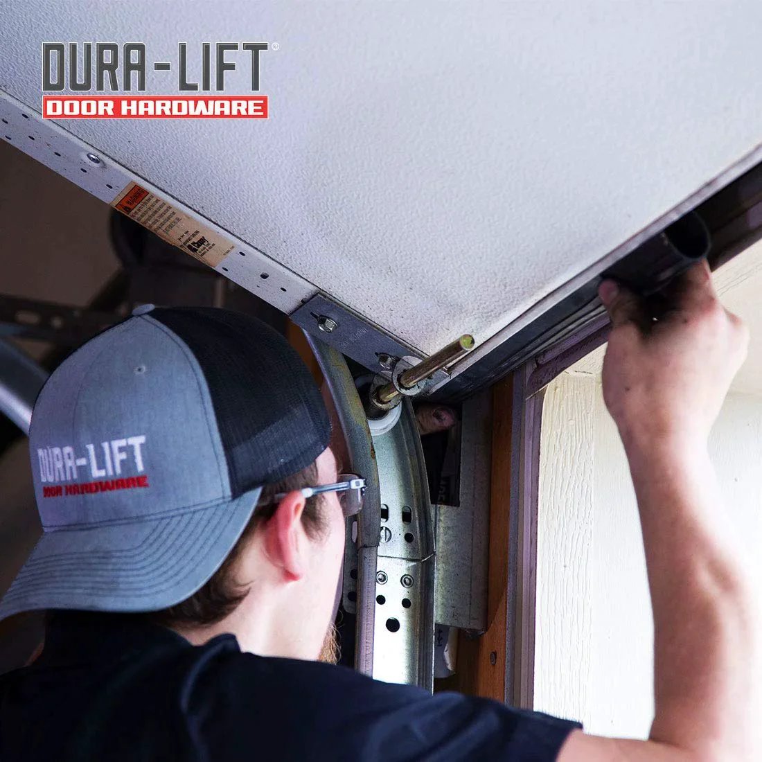 Installation of Premium EPDM Rubber Garage Door Weather Seal for 8 Foot Wide Double-T Doors by DURA-LIFT in progress