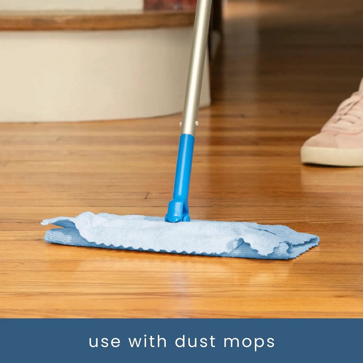 Microfiber towel from 50 Pack Microfiber Towels 11.8x11.8 In Lint-Free Reusable For Home And Car used with dust mop on wood floor.