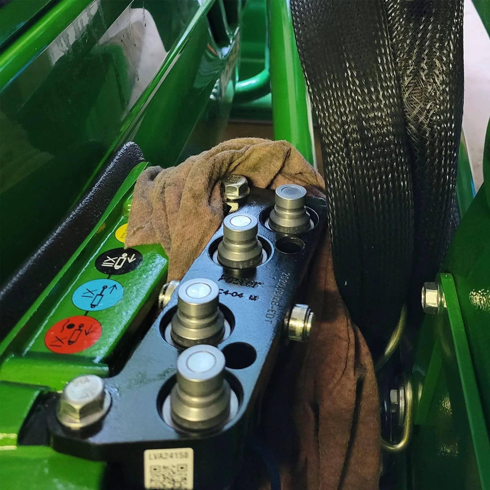 Universal Flat Face Hydraulic Quick Connect Couplers installed on skid steer