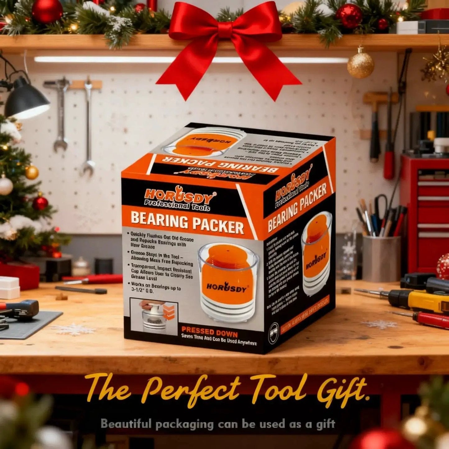 Box of Premium Wheel Bearing Packer Tool Kit With Self Contained Piston on workshop table with festive decorations.