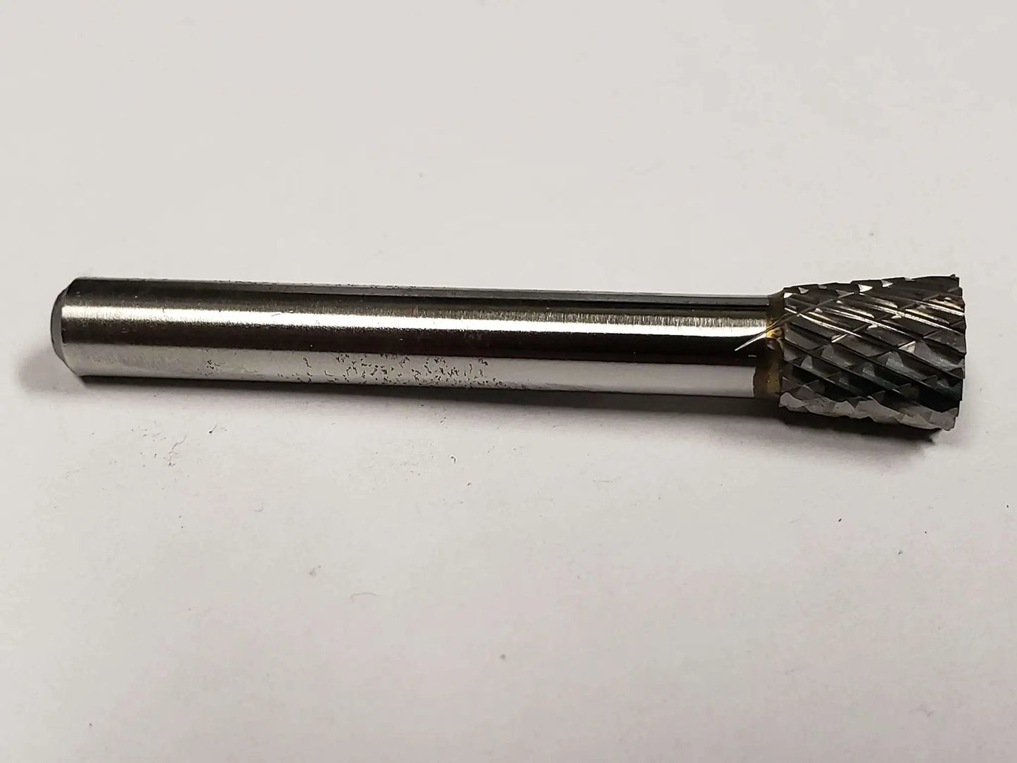 SN 2 Inverted Cone Carbide Burr With Double Cut For Metalworking, Three Eighths Inch Shank, solid tool on plain background.