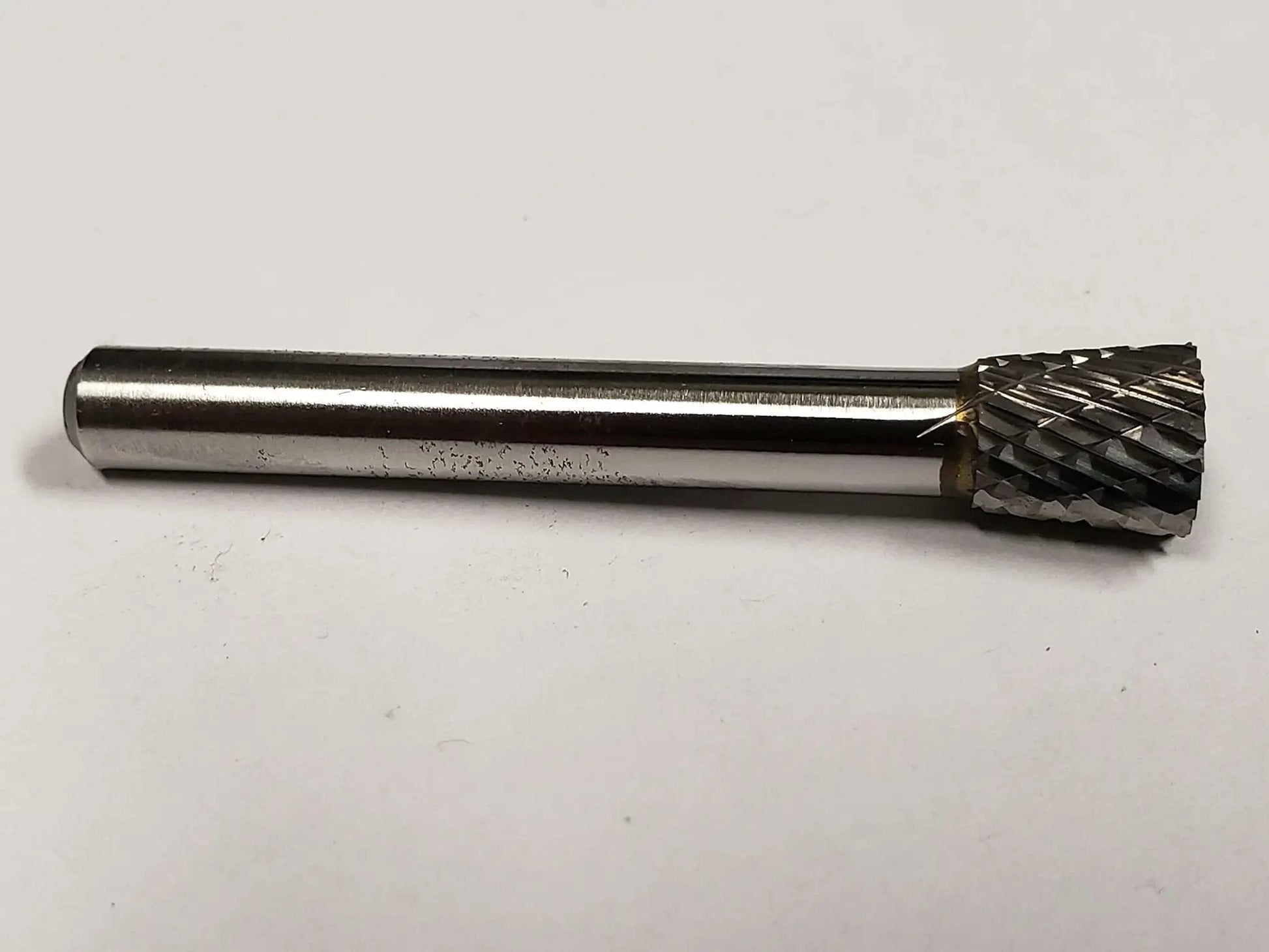 SN 2 Inverted Cone Carbide Burr With Double Cut For Metalworking, Three Eighths Inch Shank, solid tool on plain background.