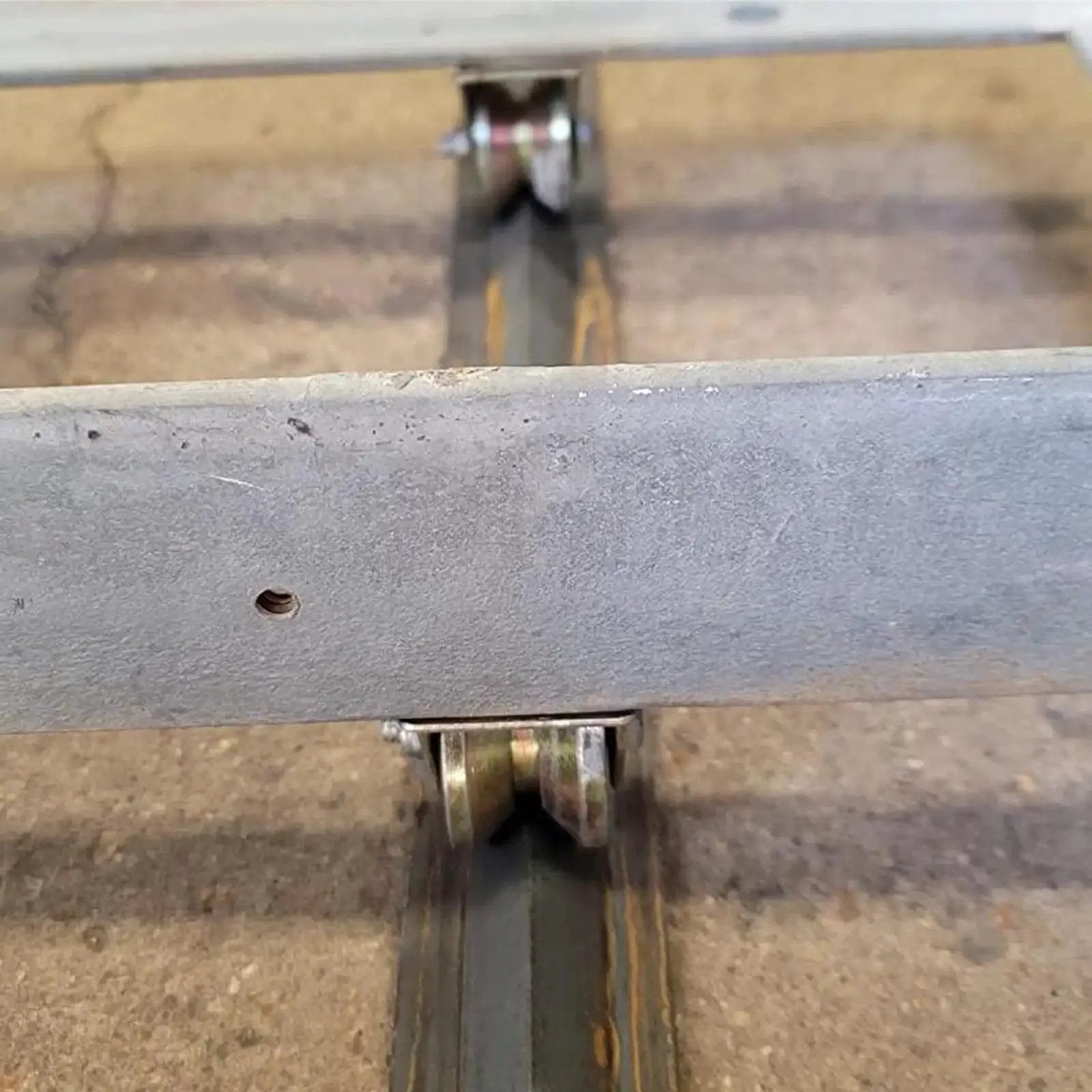 Built Tough 2 Inch V Groove Wheel Set with 8 pcs heavy duty steel caster wheels installed on track for gates and machines