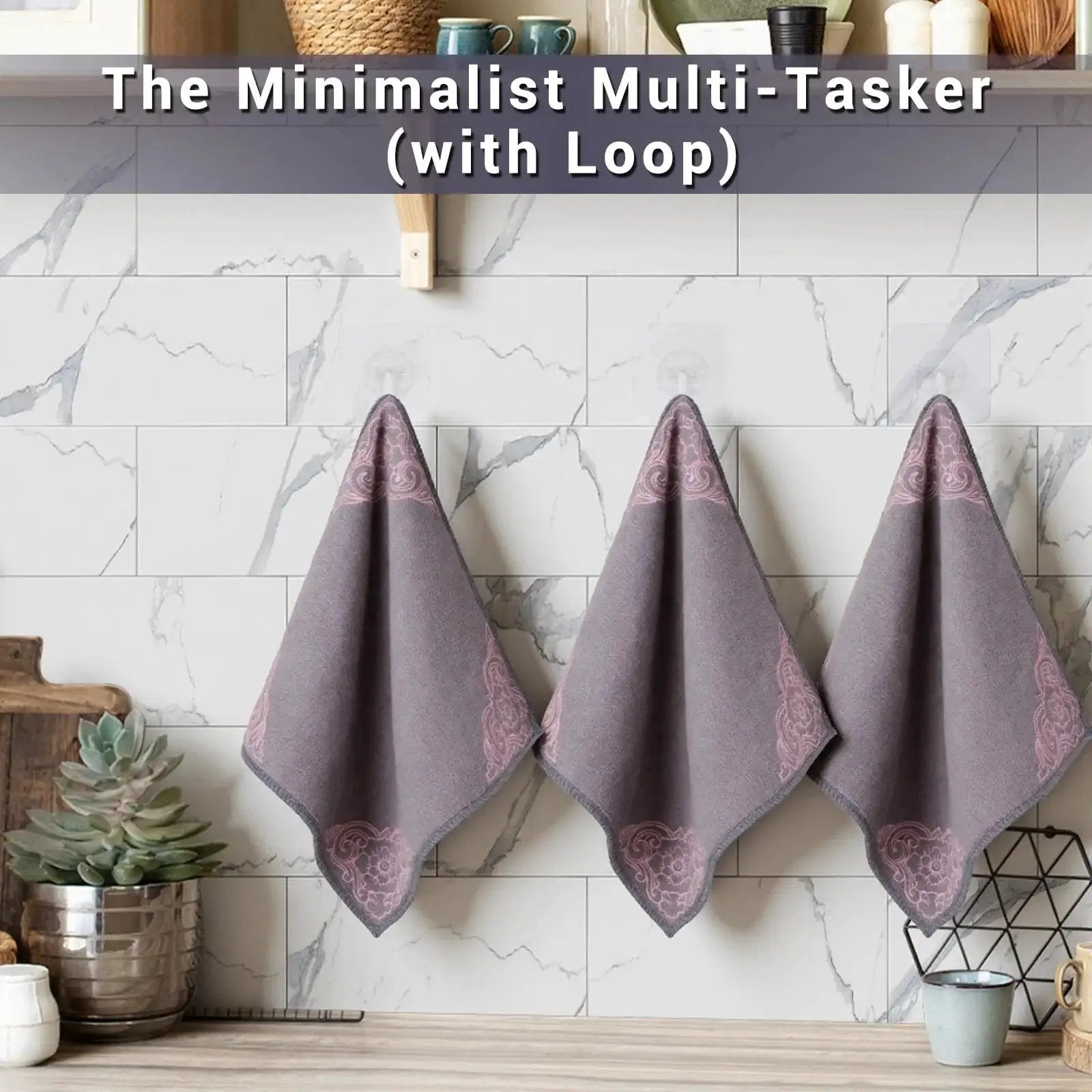 Three gray microfiber cleaning cloths hung on a kitchen wall, part of a 12 Pack Microfiber Cleaning Cloths For Cars And Home Ultra Absorbent Towels.