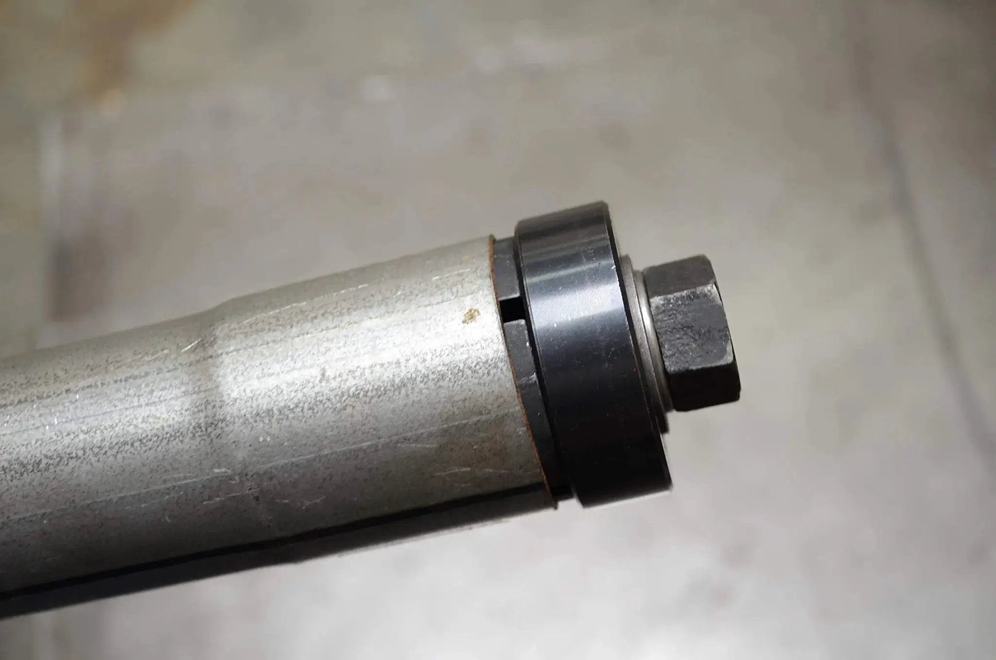 Close-up of Exhaust Pipe Stretcher Kit Heavy Duty Expander for Small to Large Exhaust Piping with steel expander in use.