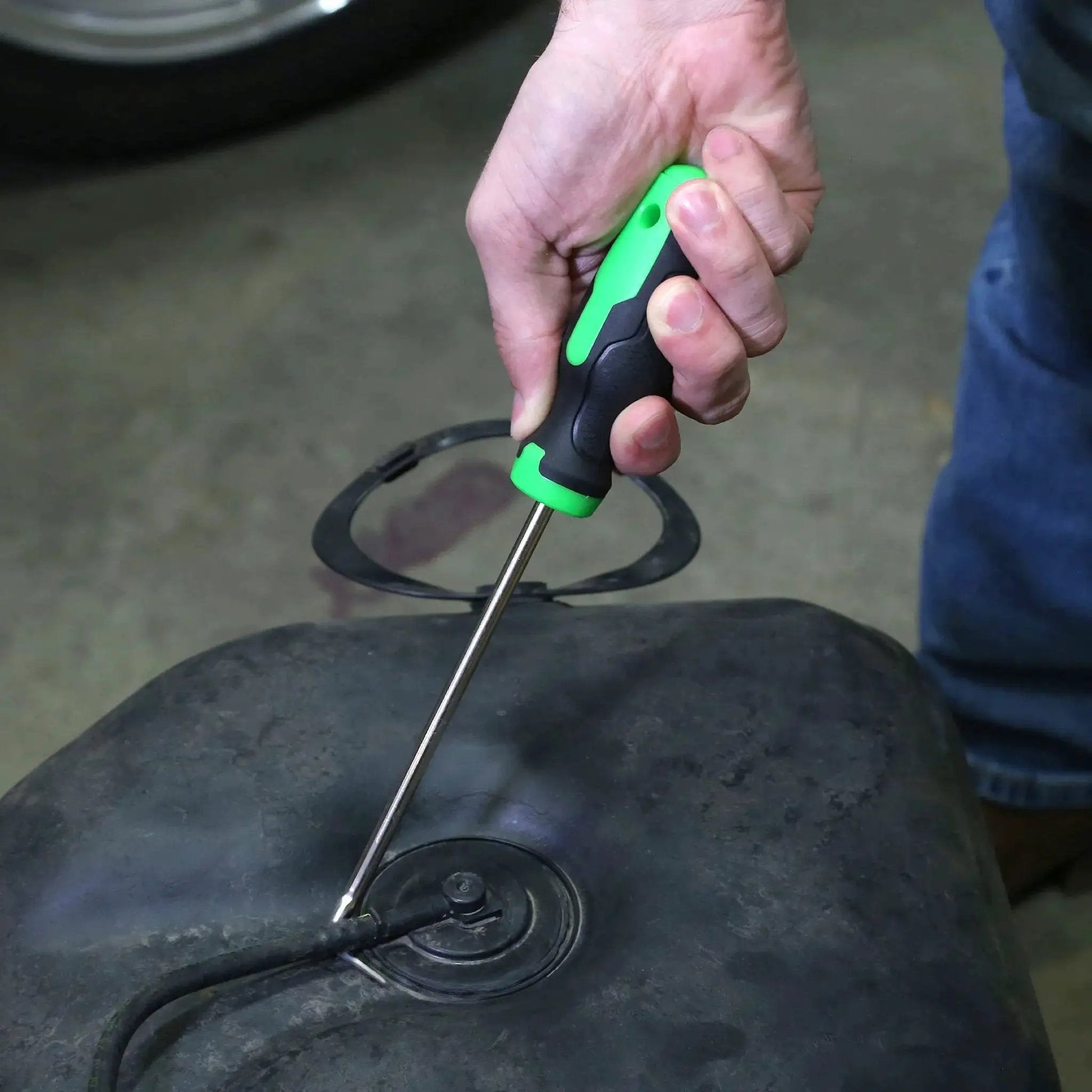 Using 5 Piece Hose Removal Set For Radiator And Coolant Lines With Cotter Pin Tool on a hose in an engine bay