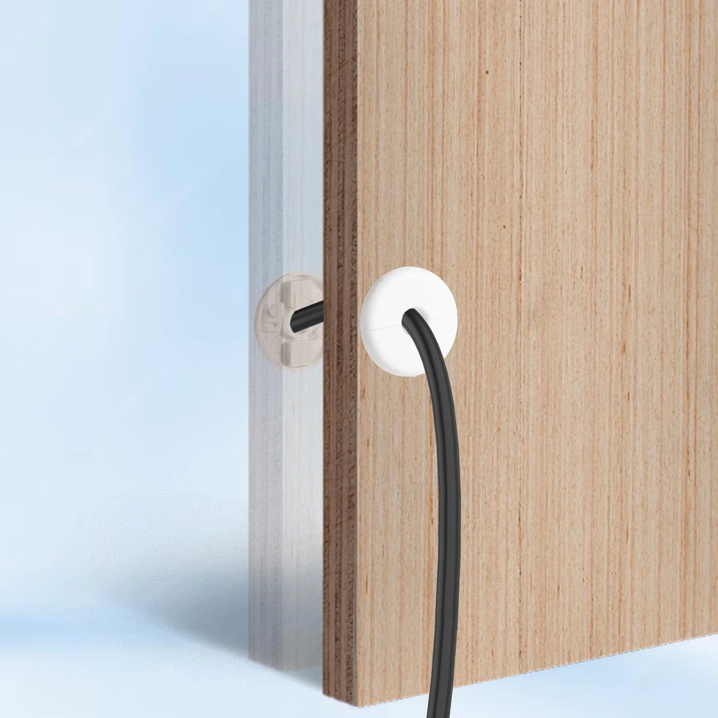 4 Pack Wall Grommets For Cables With Adhesive Backing, Anti Slip Cable Pass Through Hole Covers For Walls And Furniture, Starlink Cable Routing Kit, Wire Holes, White shown installed on wooden panel with cable passing through.