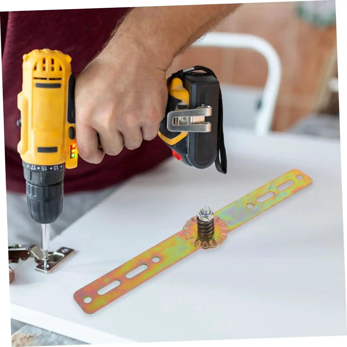 Person using drill to install Adjustable Angle Hinge For Bed Sofa And Cupboard By Alipis Beefy Heavy Duty Auto Reset Precision Engineering High Strength Construction Easy Installation Strong Load Capacity Secure Furniture Joint Durable Couch And Cabinet Hardware on surface