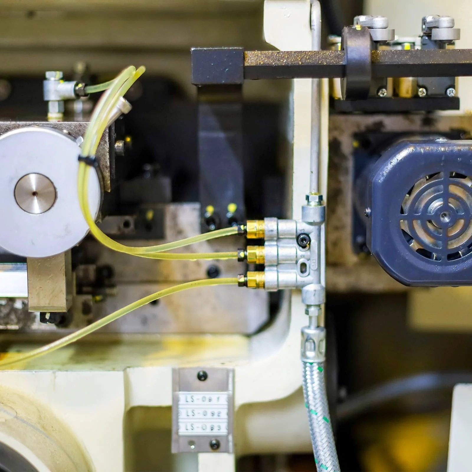 Industrial machine setup with hoses and fittings, featuring Brass Compression Ferrule Kit For One Quarter Inch OD Hose Tubing, 20 Pack