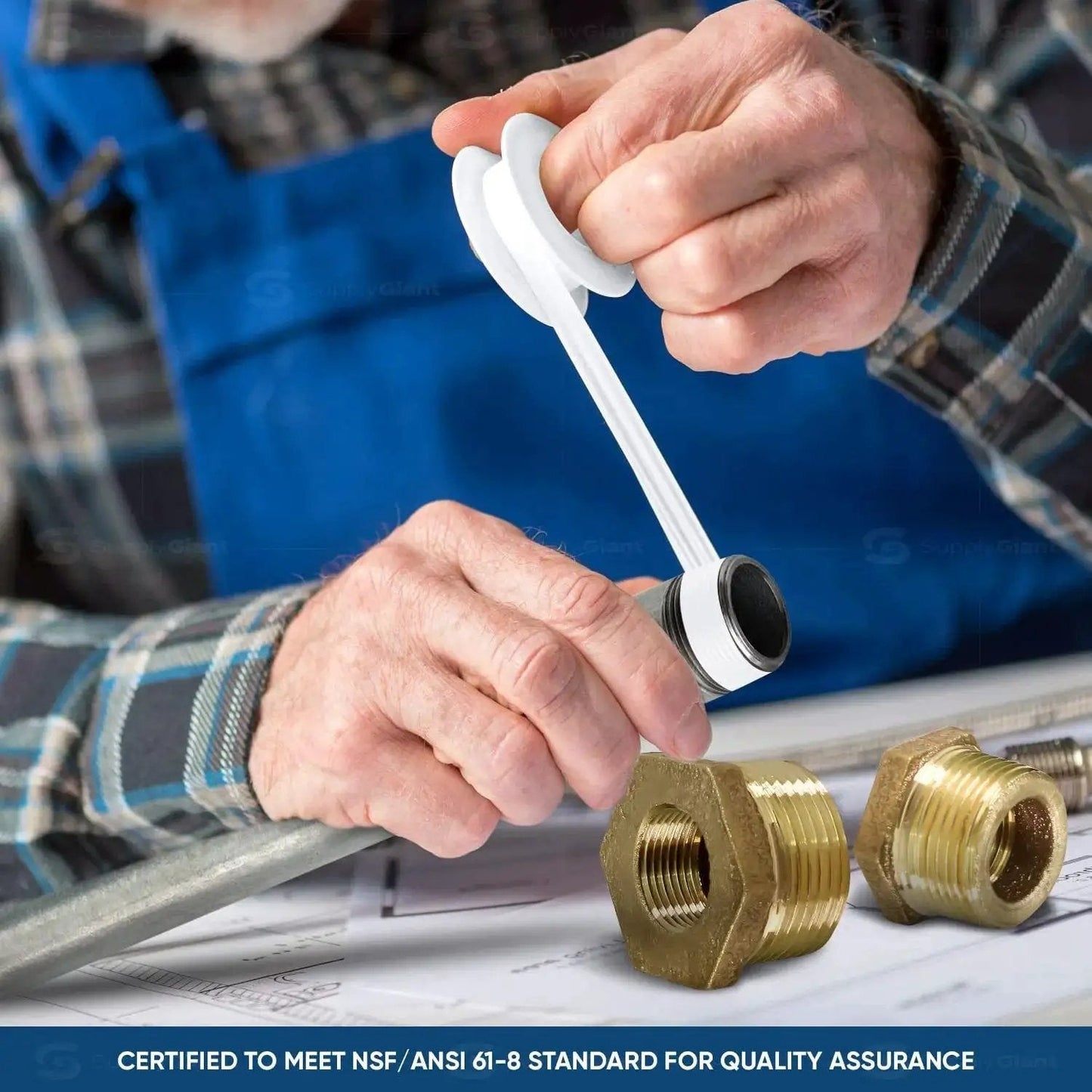 Person applying tape to 1-1/2 Inch Male NPT To 1 Inch Female Brass Bushing With Hex Head, Lead-Free Brass