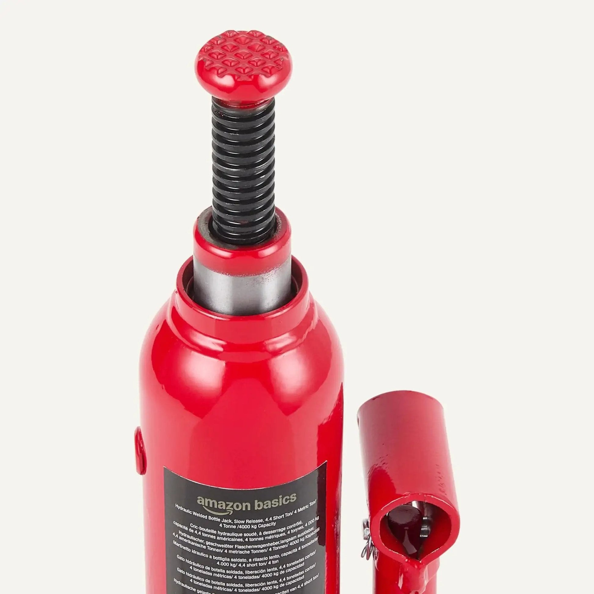 Hydraulic Bottle Jack For Vehicles With 4 Ton Capacity 4000 Kg Slow Release Valve Welded Construction Red Finish, close-up view.