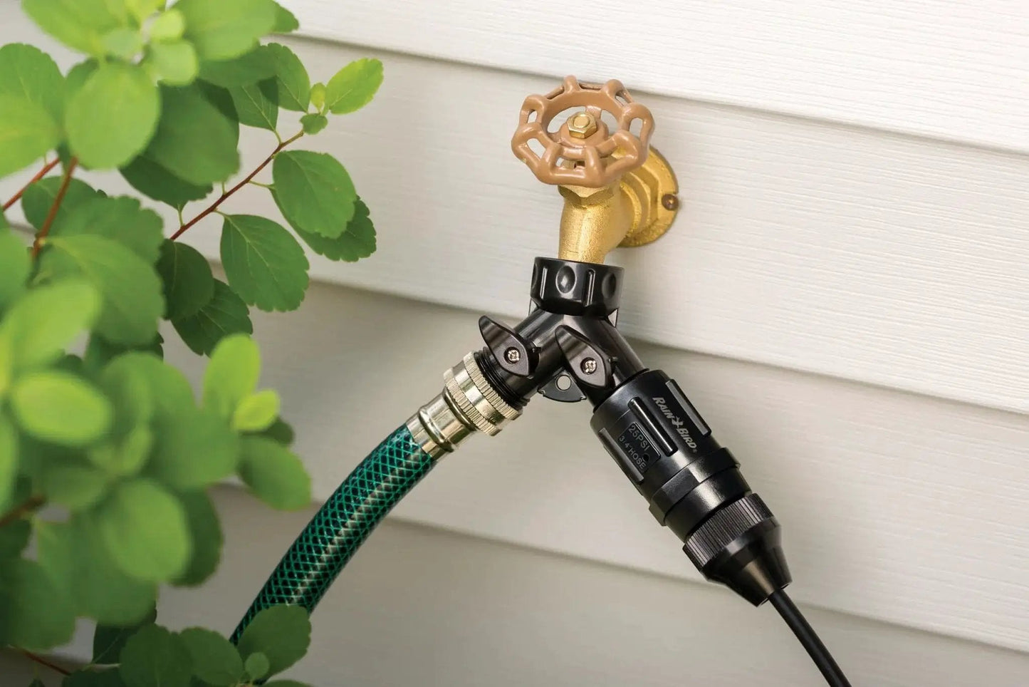 Drip Irrigation Pressure Regulator 25 PSI for garden hoses, 3/4 inch, installed on outdoor faucet, connected to hose