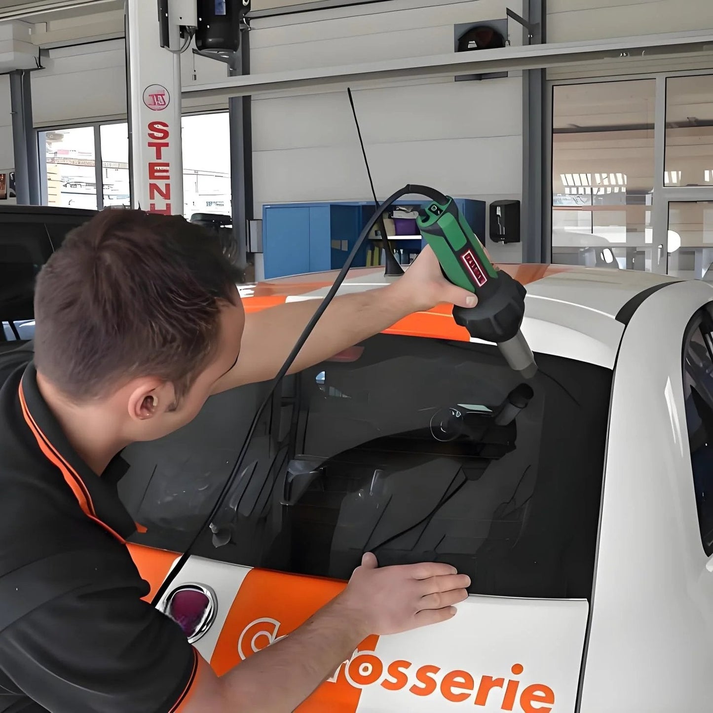 Person using Pro Grade W100.702 Ceramic Heating Core Replacement for 120V 1600W Hot Air Welder on car window