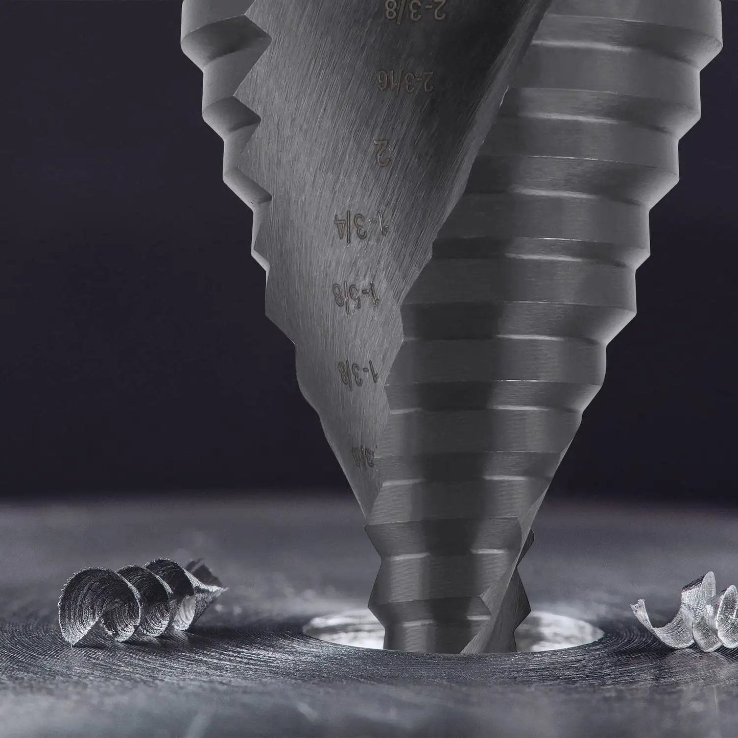 Close-up of Jumbo Two And Three Eighths Inches Step Drill Bit Set for Metal By Lichamp Unibit With Spiral Grooved Design