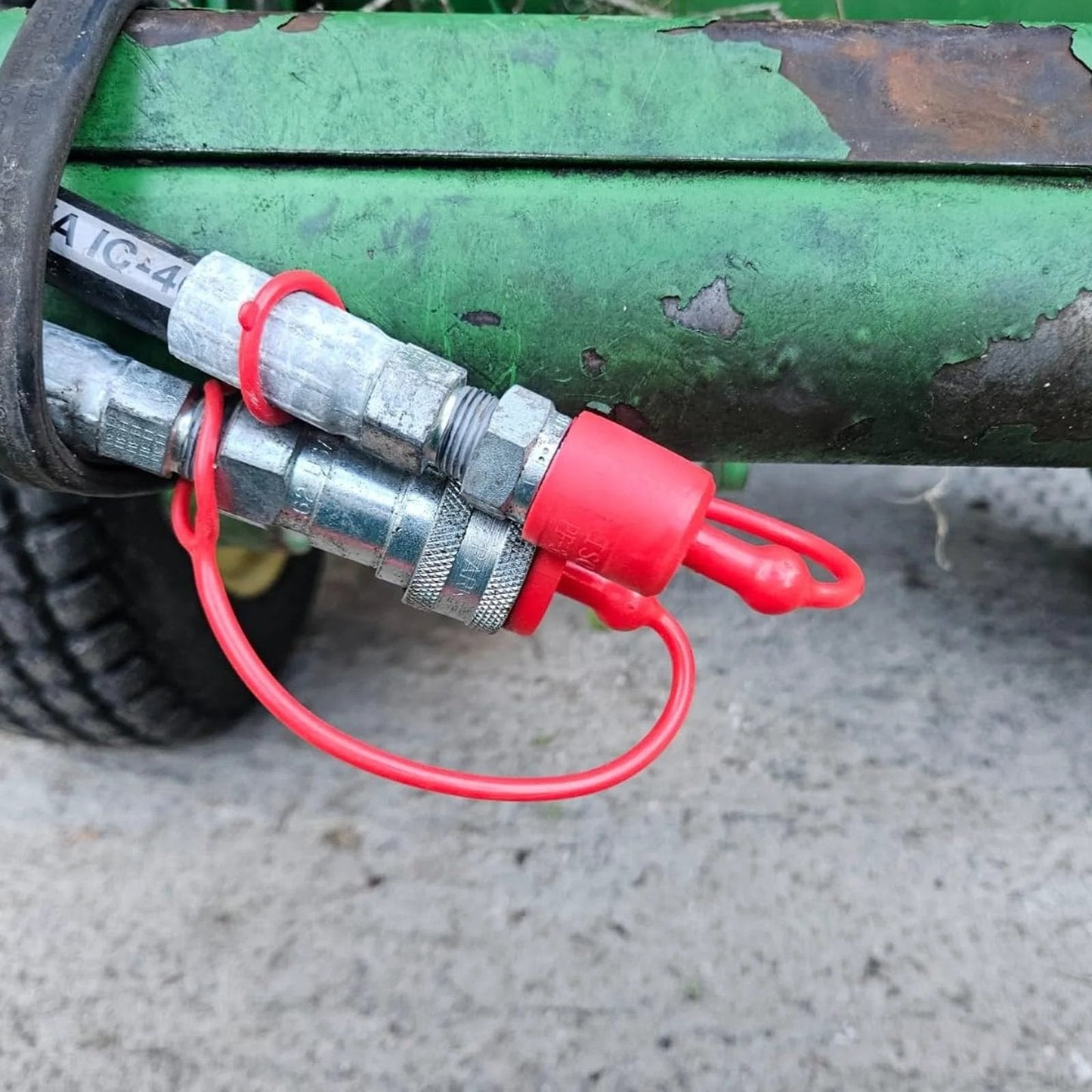 Dust Cap And Plug Kit For Half Inch Flat Face Hydraulic Quick Connect Couplers Includes Four Male And Four Female Rubber Covers Universal Fit For Skid Steer Bobcat Attachments installed on machinery.