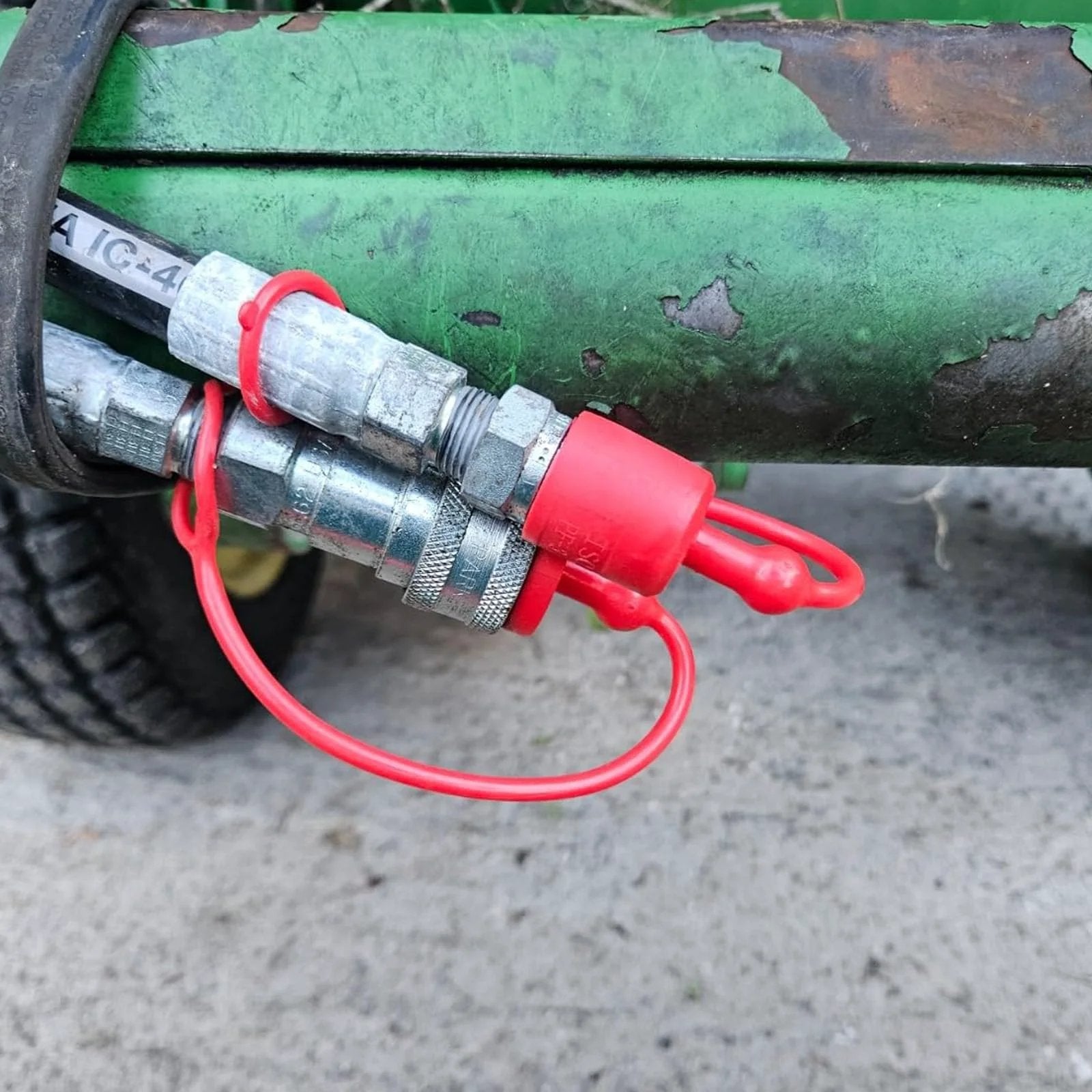 Dust Cap And Plug Kit For Half Inch Flat Face Hydraulic Quick Connect Couplers Includes Four Male And Four Female Rubber Covers Universal Fit For Skid Steer Bobcat Attachments installed on machinery.