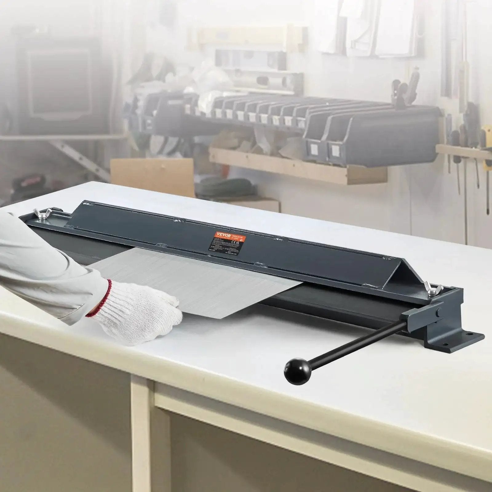 Box And Pan Brake 36 Inch Portable Sheet Metal Bender For 0 To 130 Degree Bends on a workbench in a workshop setting