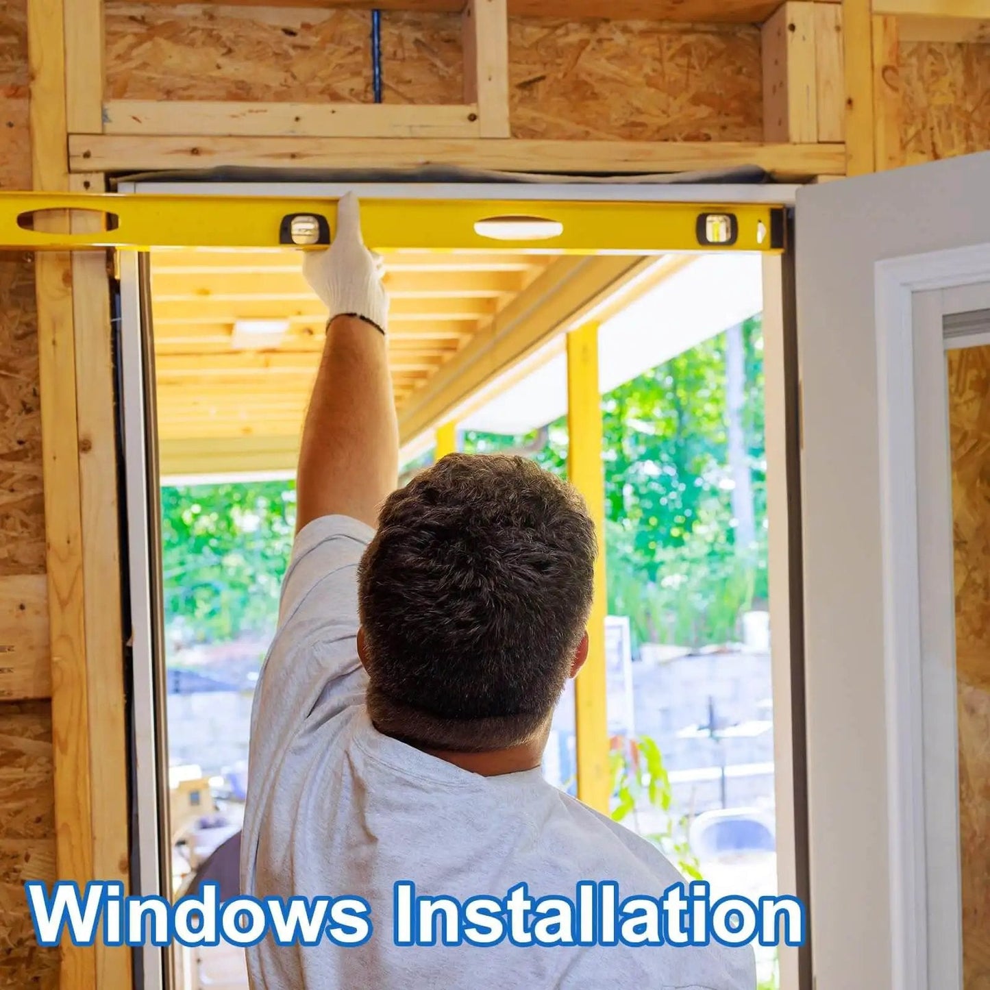 Person installing a window using a level tool during structural framing, ensuring precise alignment in a home improvement project.