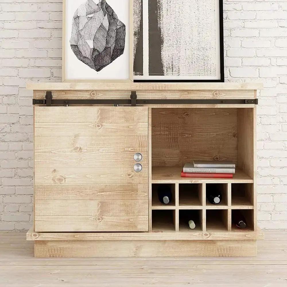 Wooden cabinet with sliding barn door, featuring metal rails and wine storage on white brick wall backdrop.