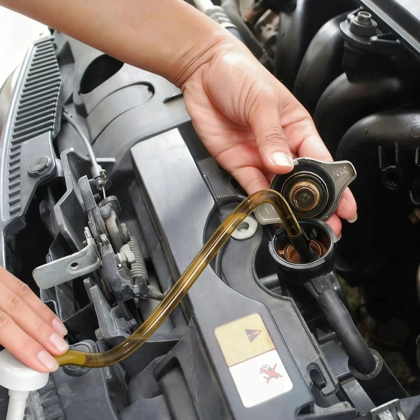 Using Two Pack Fluid Pump For Quart Bottles With 10cc Stroke And 3rd Hand Adapter to transfer fluid into car engine