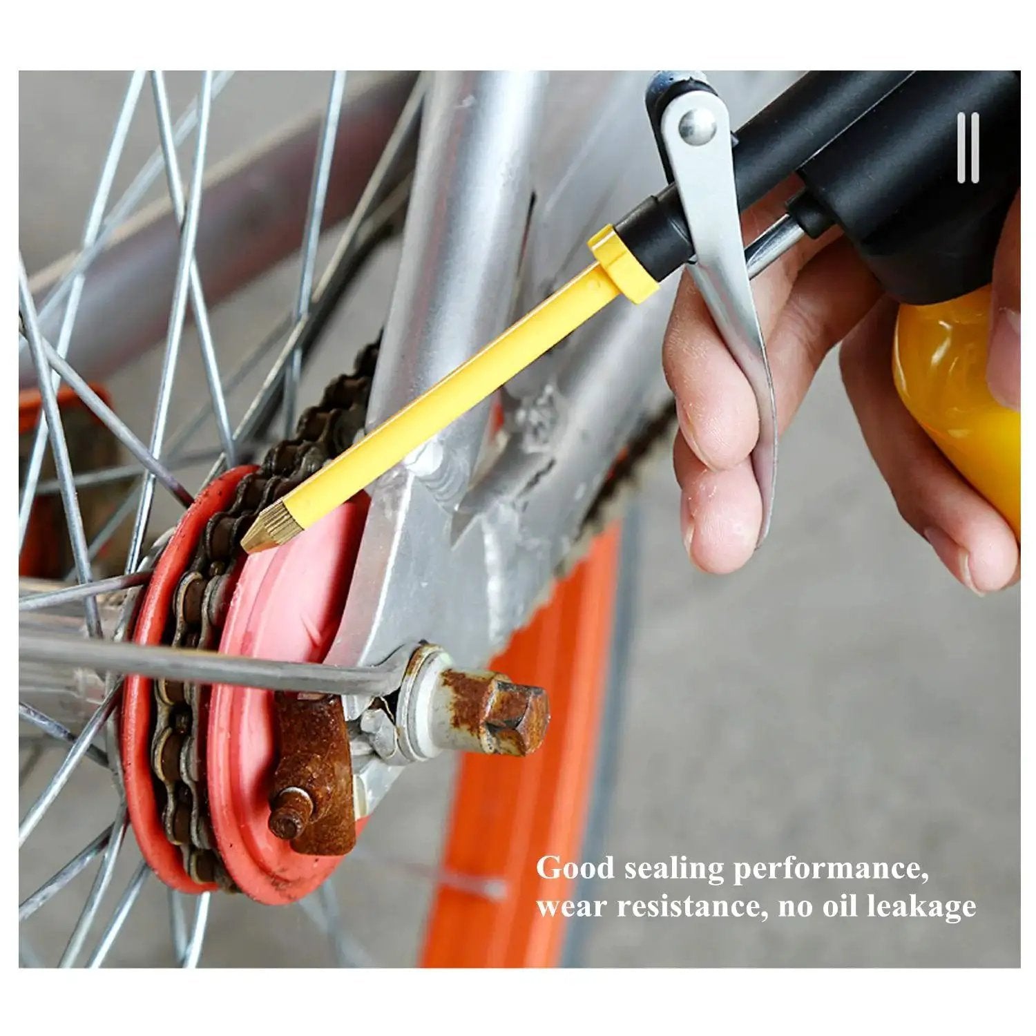 Durable Yellow Metal Oiler Can With Dual Spouts And Built In Pump 8oz 250ml 9 Inch Flexible Spout And 3 Inch Straight Nozzle in use on bicycle chain