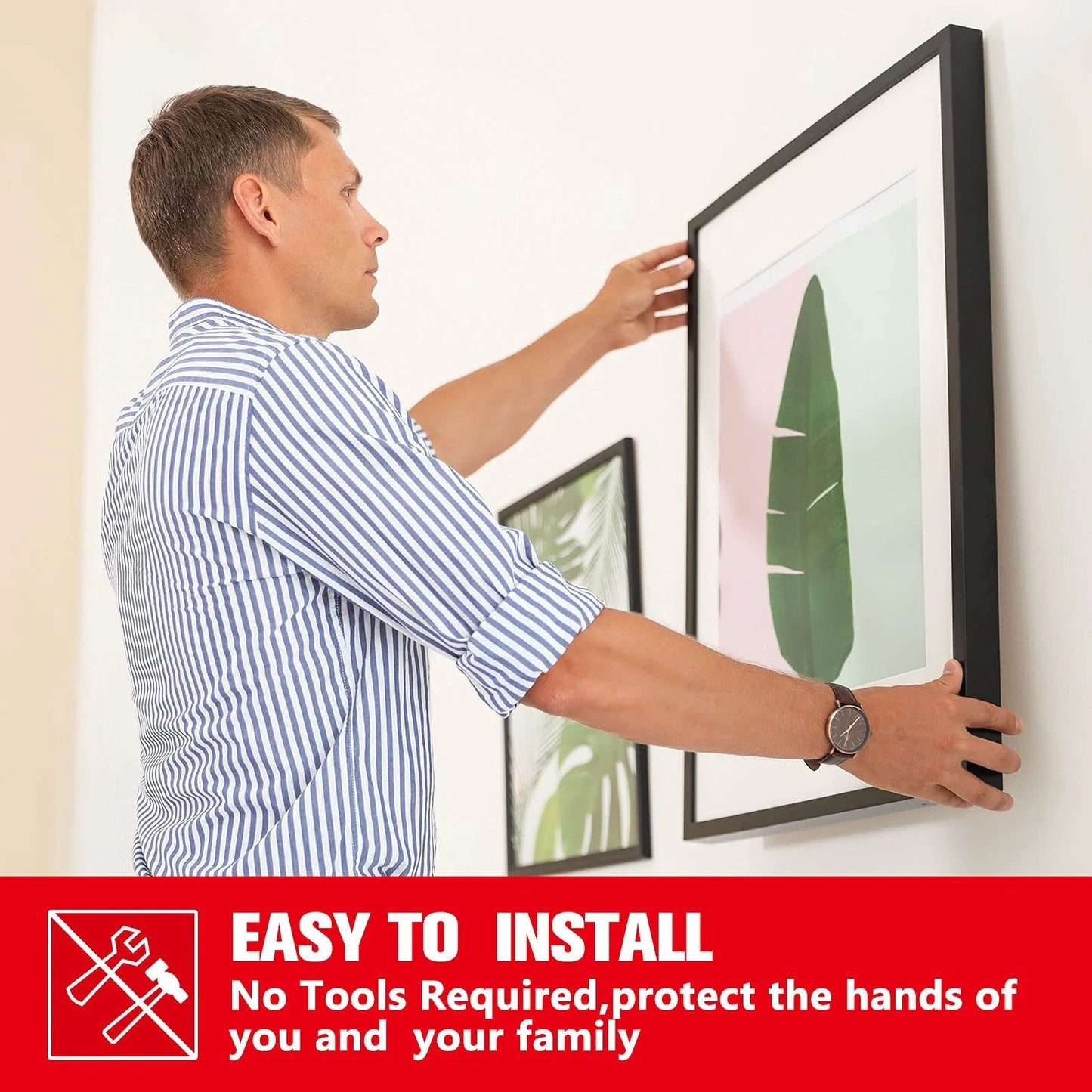 Man installing a picture frame using heavy duty waterproof double sided foam tape 33ft long 0.4 inch wide strong adhesive mounting tape.