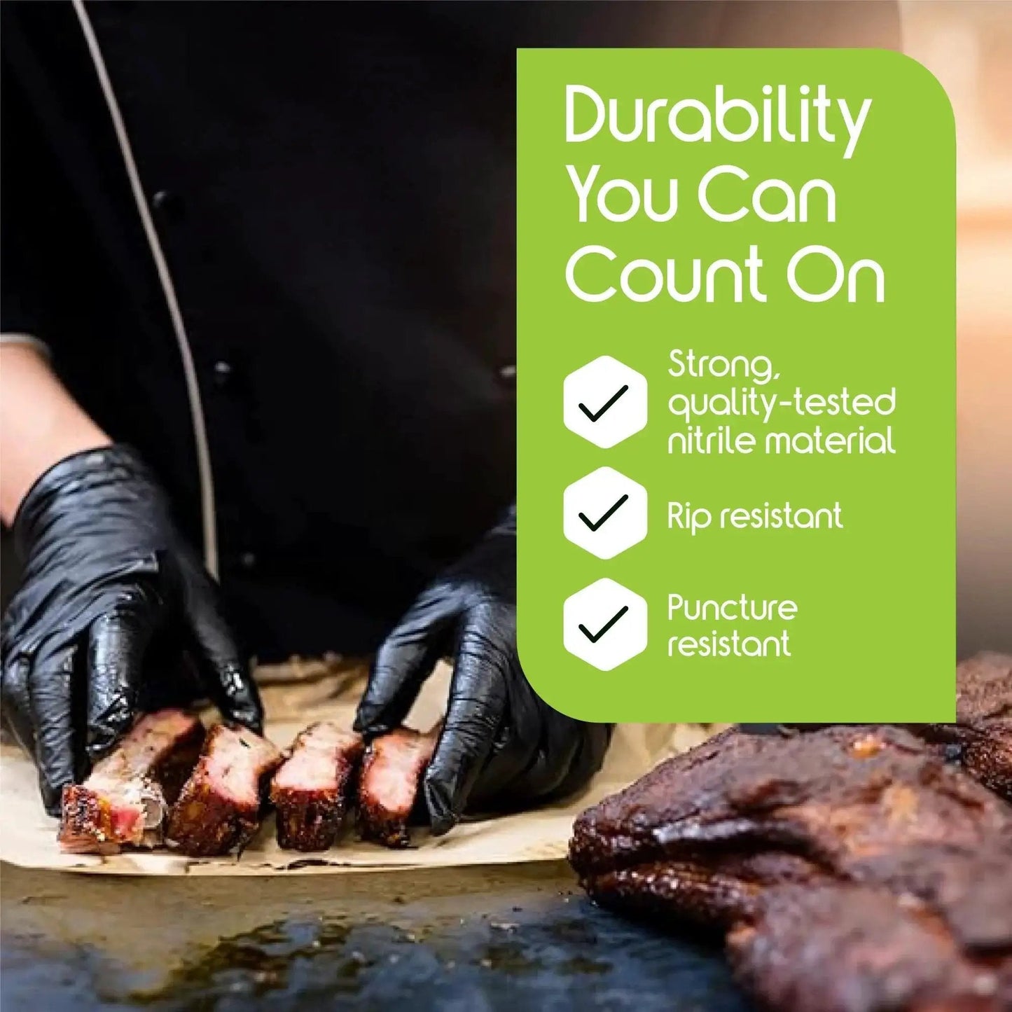 Black Nitrile Gloves Disposable Latex Free 4.5 Mil Medium used for handling cooked ribs in a kitchen setting