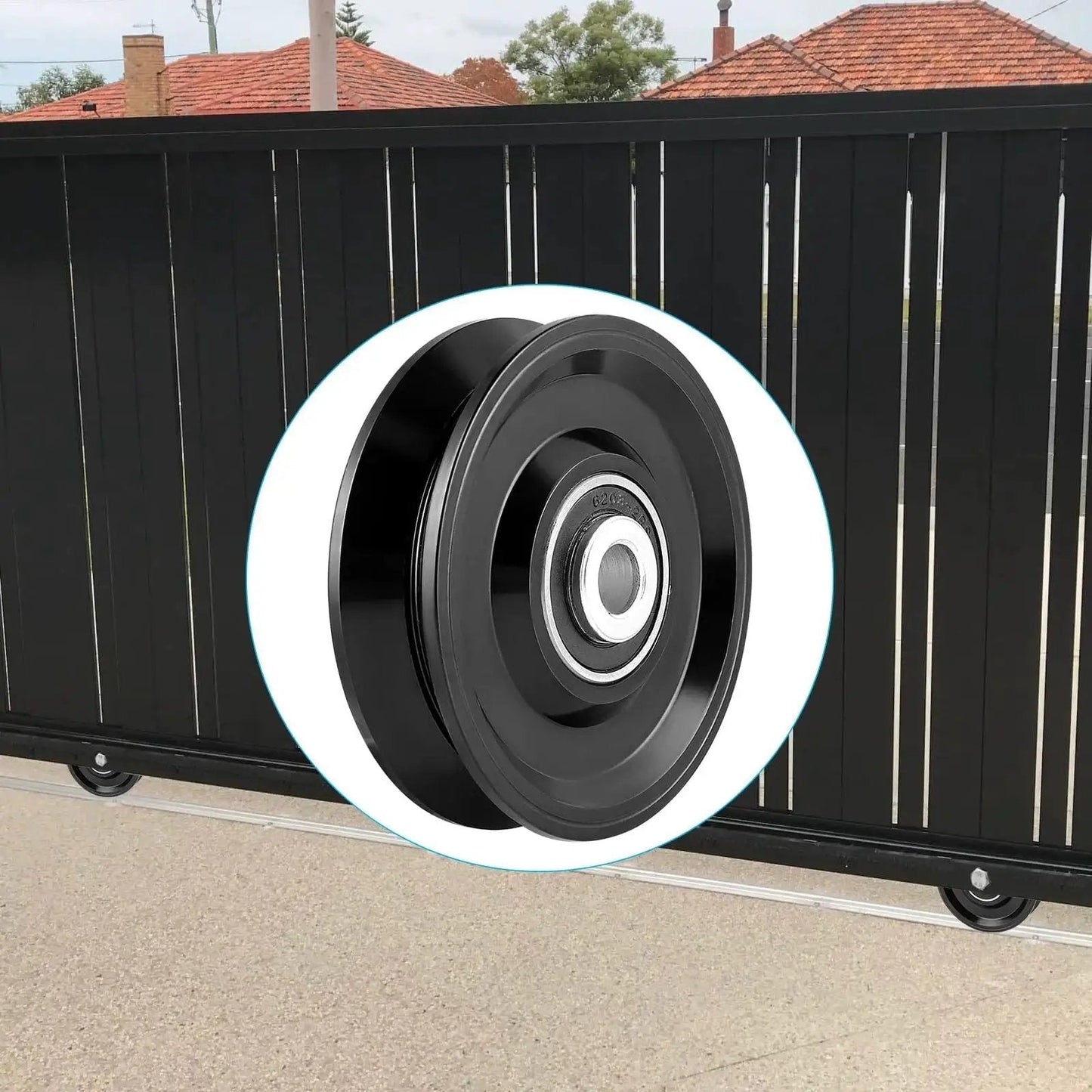 V Groove Wheel Caster for Inverted V Track with double bearings, steel AISI 1045, shown in front of a black gate.