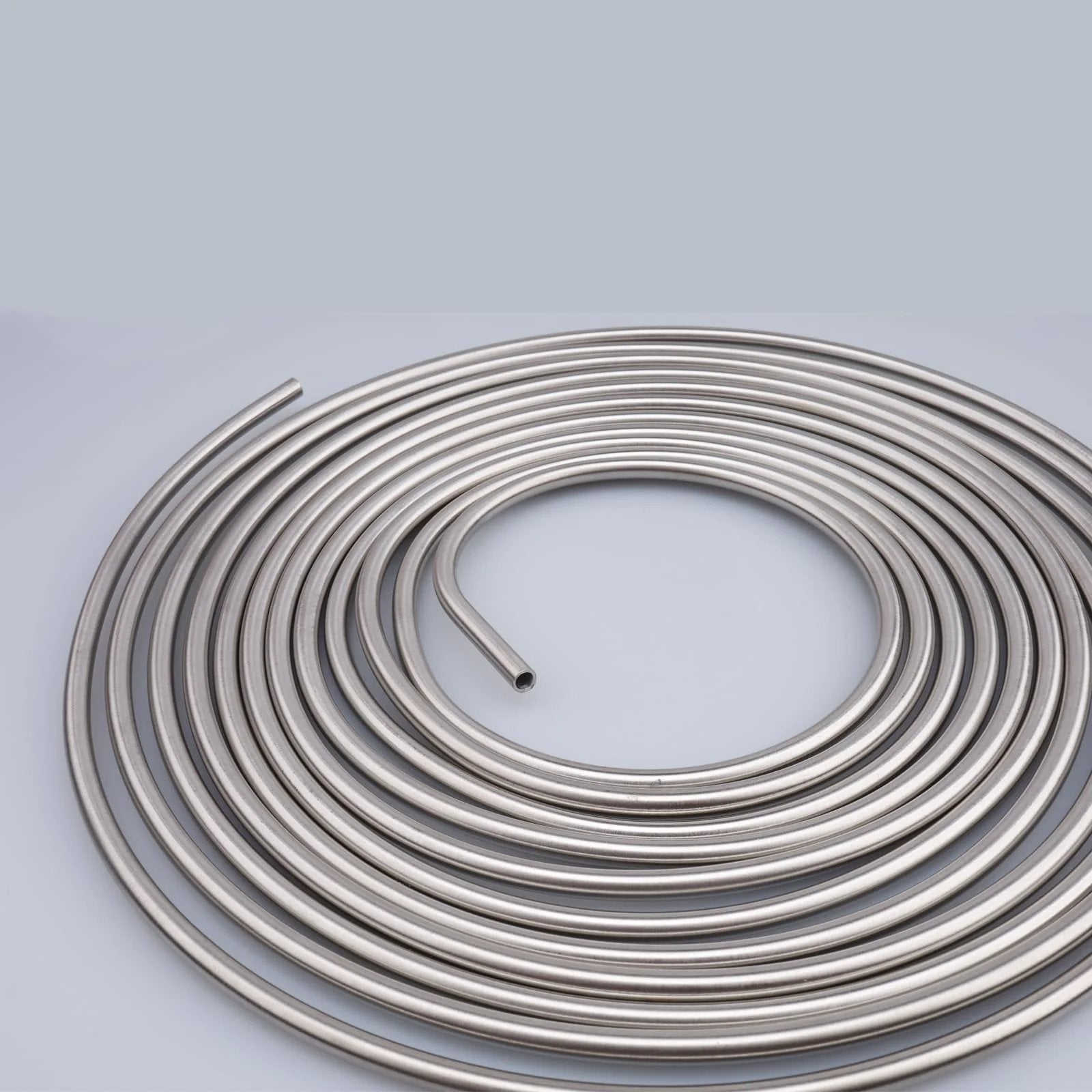 Quarter Inch Stainless Steel Brake Line Coil, 16 Feet Long Hard Tubing, 304 Stainless Steel with 0.7mm Wall coiled on surface