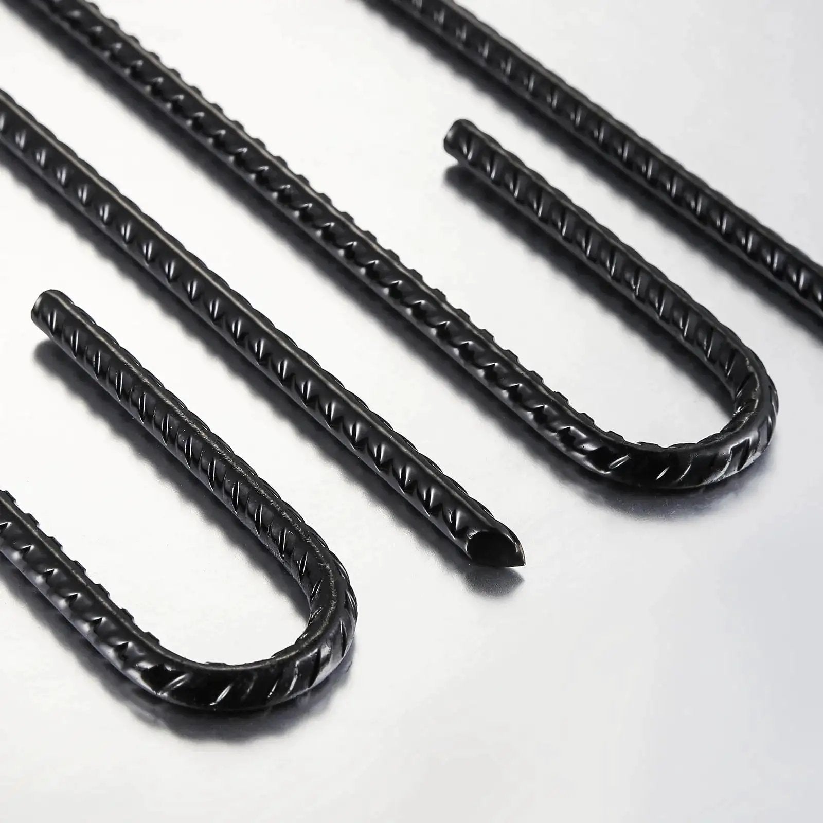 Extra Heavy Duty UJ Hook Rebar Ground Anchors Twelve Inch Long By One Quarter Inch Diameter Rust Proof Coated Steel For Garden Tent And Trampoline Fifty Pieces J Hook For Outdoor Use To Secure Tents Canopies Play Equipment In Wind in a close-up view