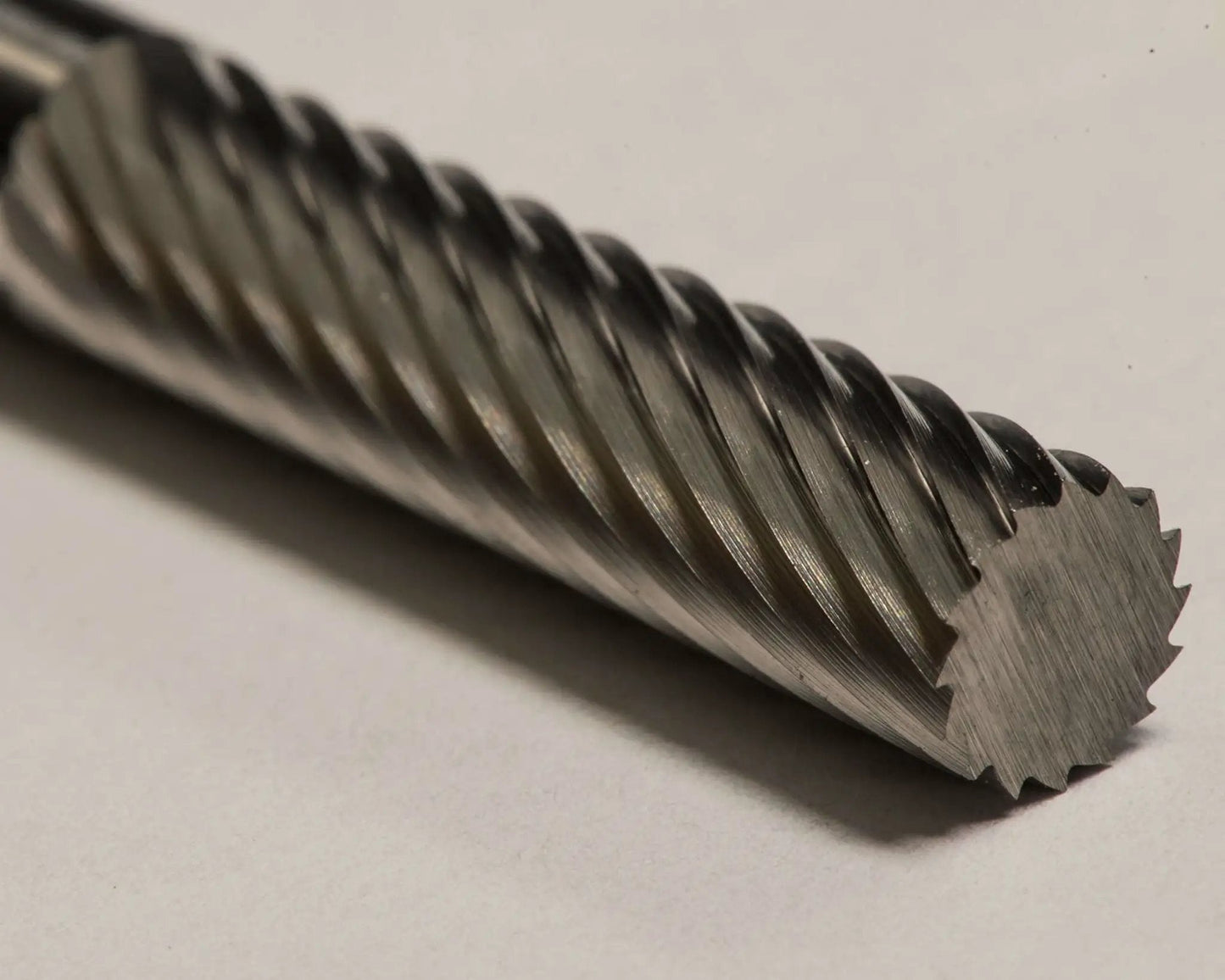 Close-up of SA-1L 1/4 Inch Cylinder Bur Single Cut Solid Carbide showing detailed spiral cutting edges for precision machining.