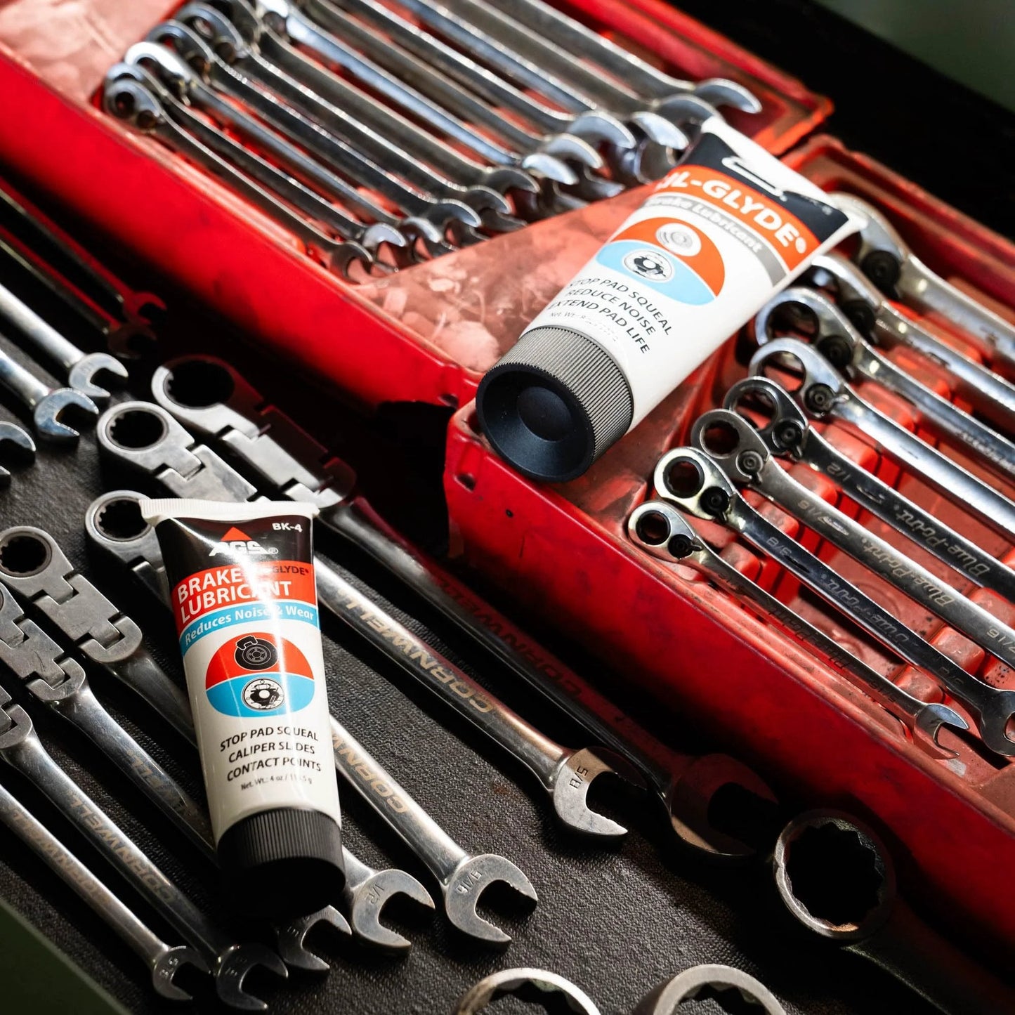 Disc Brake Squeal Eliminator With Silicone Based Brake Lubricant For Full Assembly Keeps Noise Down While Shielding Components From Moisture Heat And Rust AGS Sil Glyde 4 Oz Tube shown with wrenches in tool box