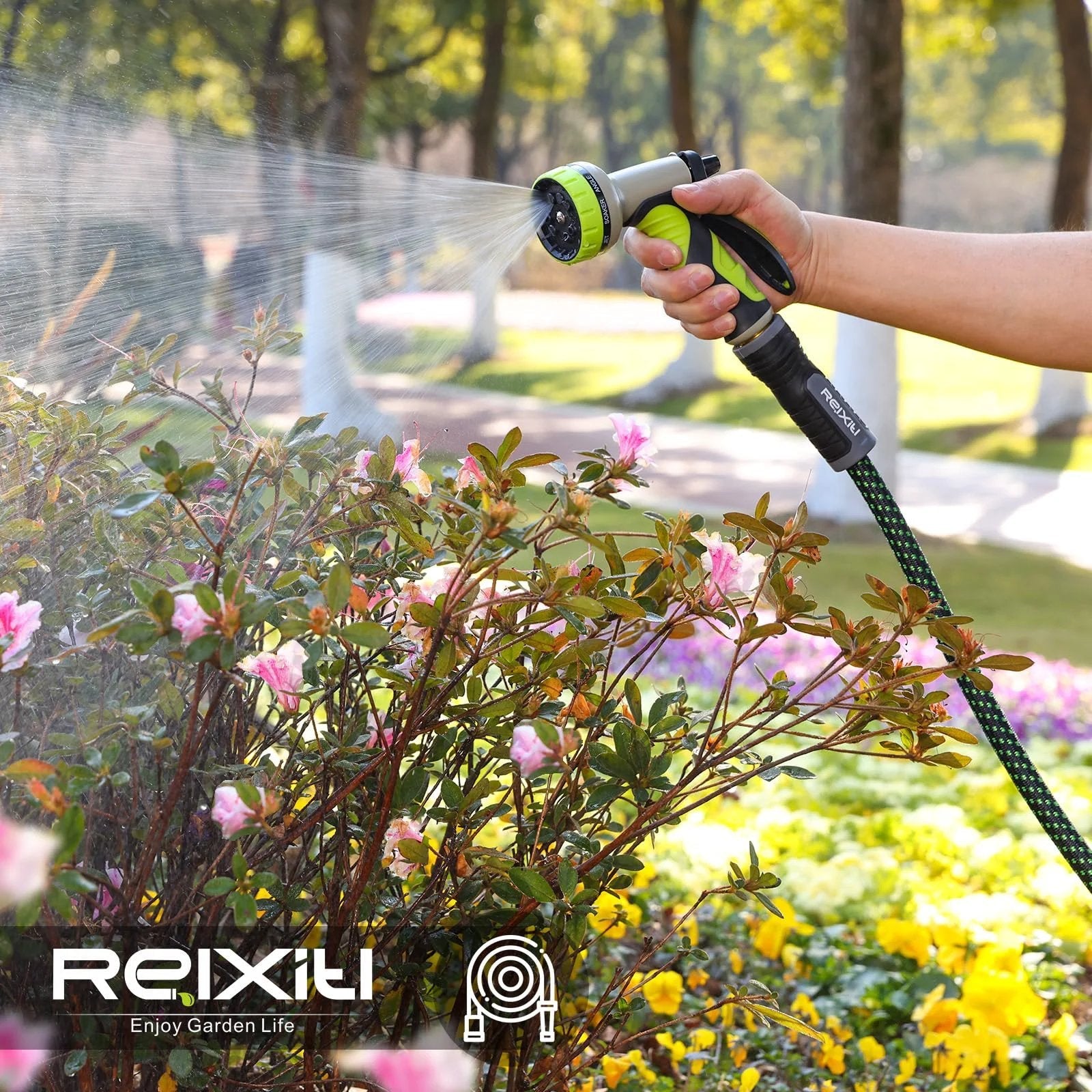 Hand holding Flexible Garden Hose For Yard And Lawn With 10 Function Sprayer No Fuss Ultra Lightweight spraying flowers