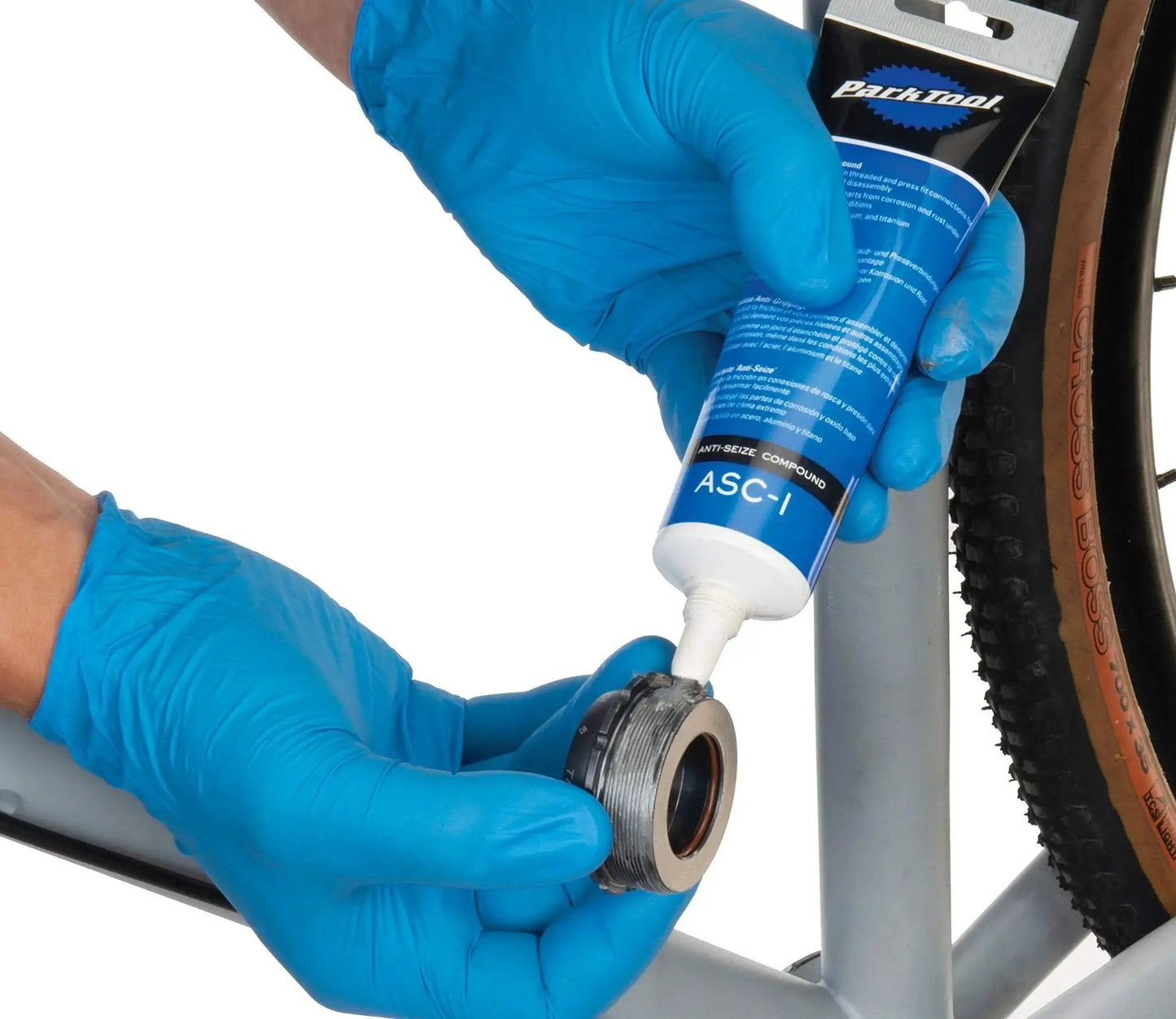 Application of Anti Seize Compound ASC 1 For Bike And Mechanical Assemblies, Reduces Friction In Threads And Press Fits, Protects Parts From Corrosion And Rust In Extreme Conditions, Seals And Guards Steel Aluminum And Titanium, 4 Oz Tube on bike part.