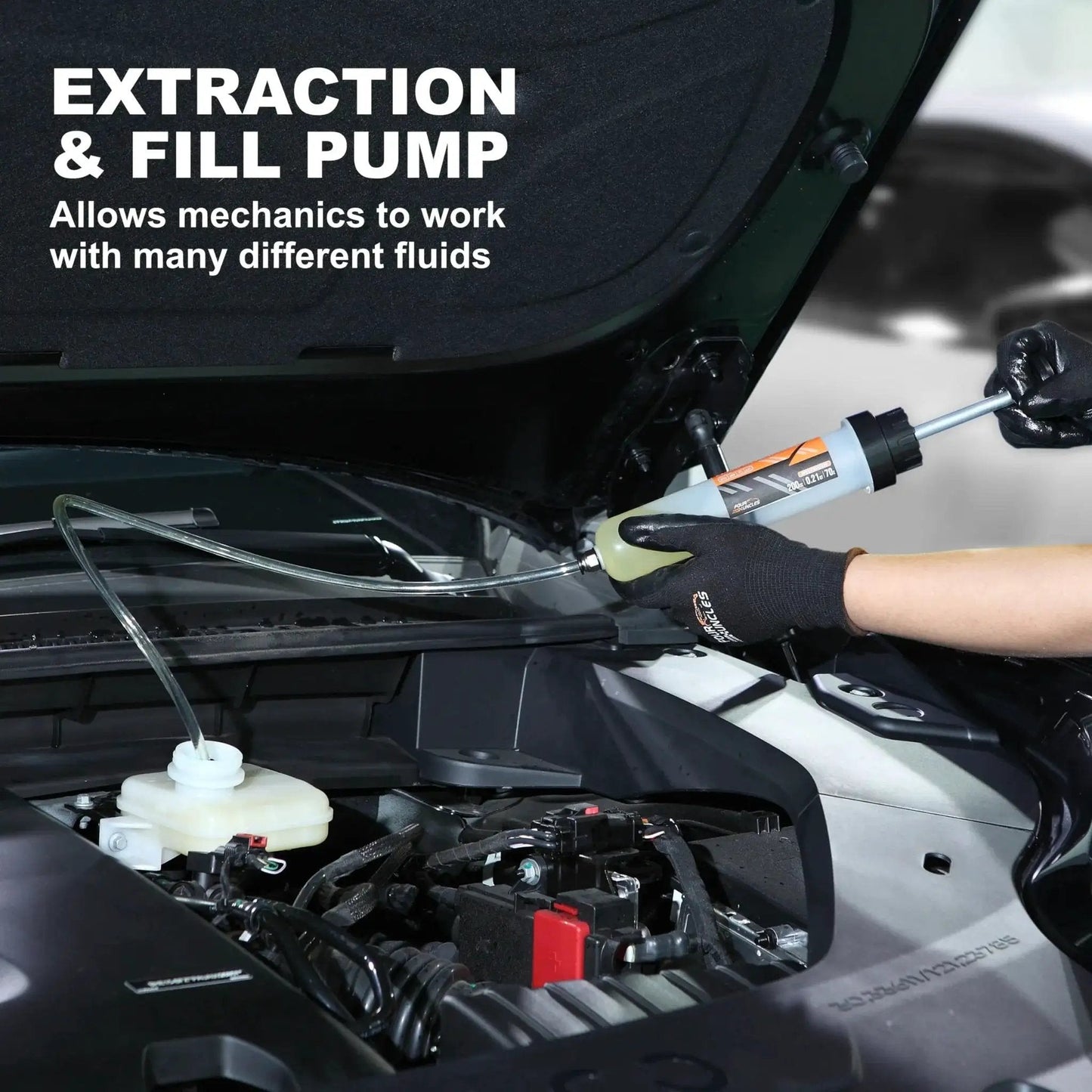 Mechanic using 200cc Fluid Extractor And Fill Pump For Automotive Use With 23 Inch Reach Hose in car engine bay