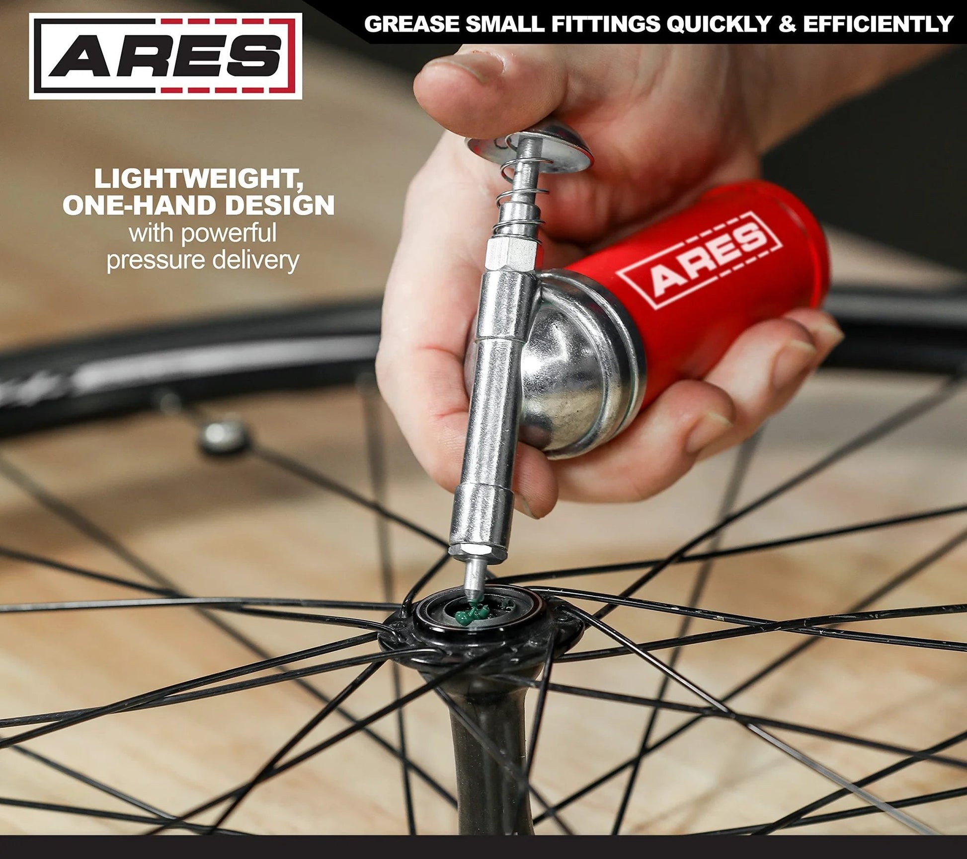 Push Type Mini Grease Gun With Needle Nozzle For Small Fittings, Grab And Go One Handed Operation, 3 Ounce Capacity, 3000 PSI Working Pressure, ARES 53010 in use on bicycle wheel