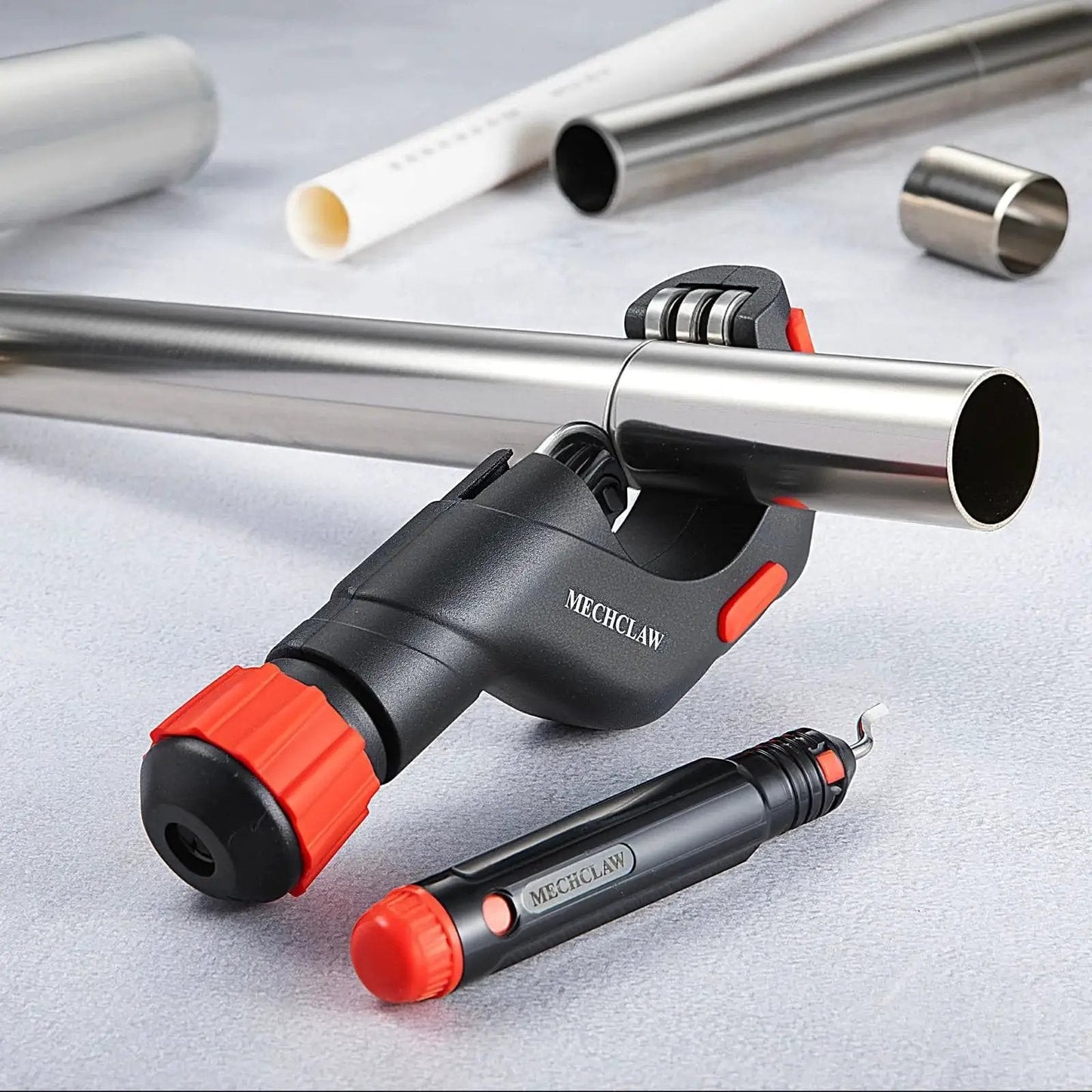 Heavy Duty Tube Cutter For Copper Iron Aluminum And Stainless Steel Pipes Cuts From Three Sixteenths To Two Inches Outer Diameter Hand Operated Pipe Cutter With Deburring Tool And Replaceable Blade For Plumbing And HVAC Projects shown cutting metal pipe.