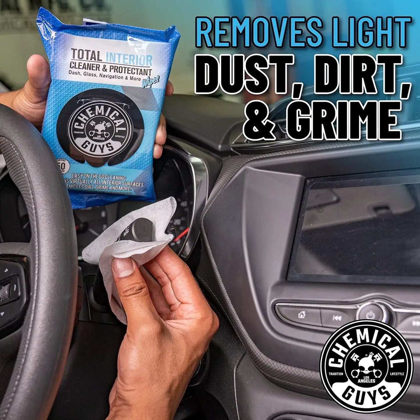 Hand holding Total Interior Cleaner And Protectant Wipes Mega 50 Pack For Cars Trucks SUVs Motorcycles RVs And More Safe Easy Clean Up No Mess For All Surfaces By Chemical Guys in car interior.