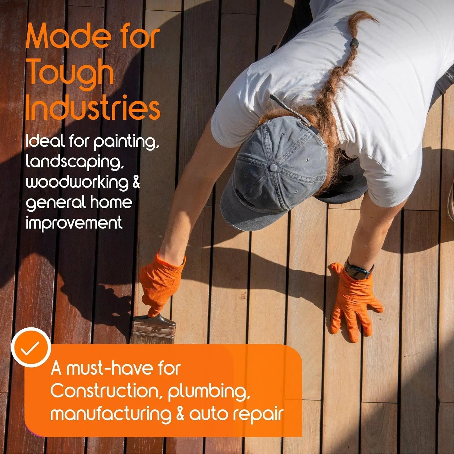 Person wearing Orange Nitrile Gloves 8 Mil Heavy Duty Diamond Textured Grip Large 100 Count while painting a deck
