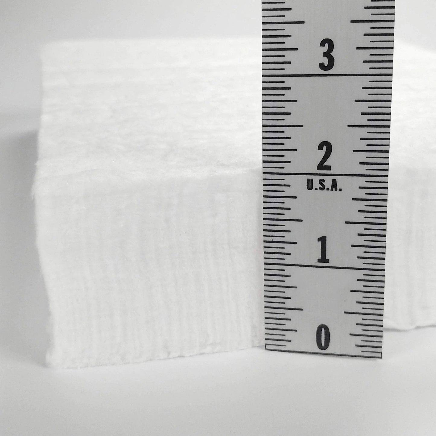 Side view of Heavy Duty Ceramic Fiber Insulation Blanket 2 Inch Thick By 15 By 24 In 2400 F Fireproof Heat Shield next to ruler