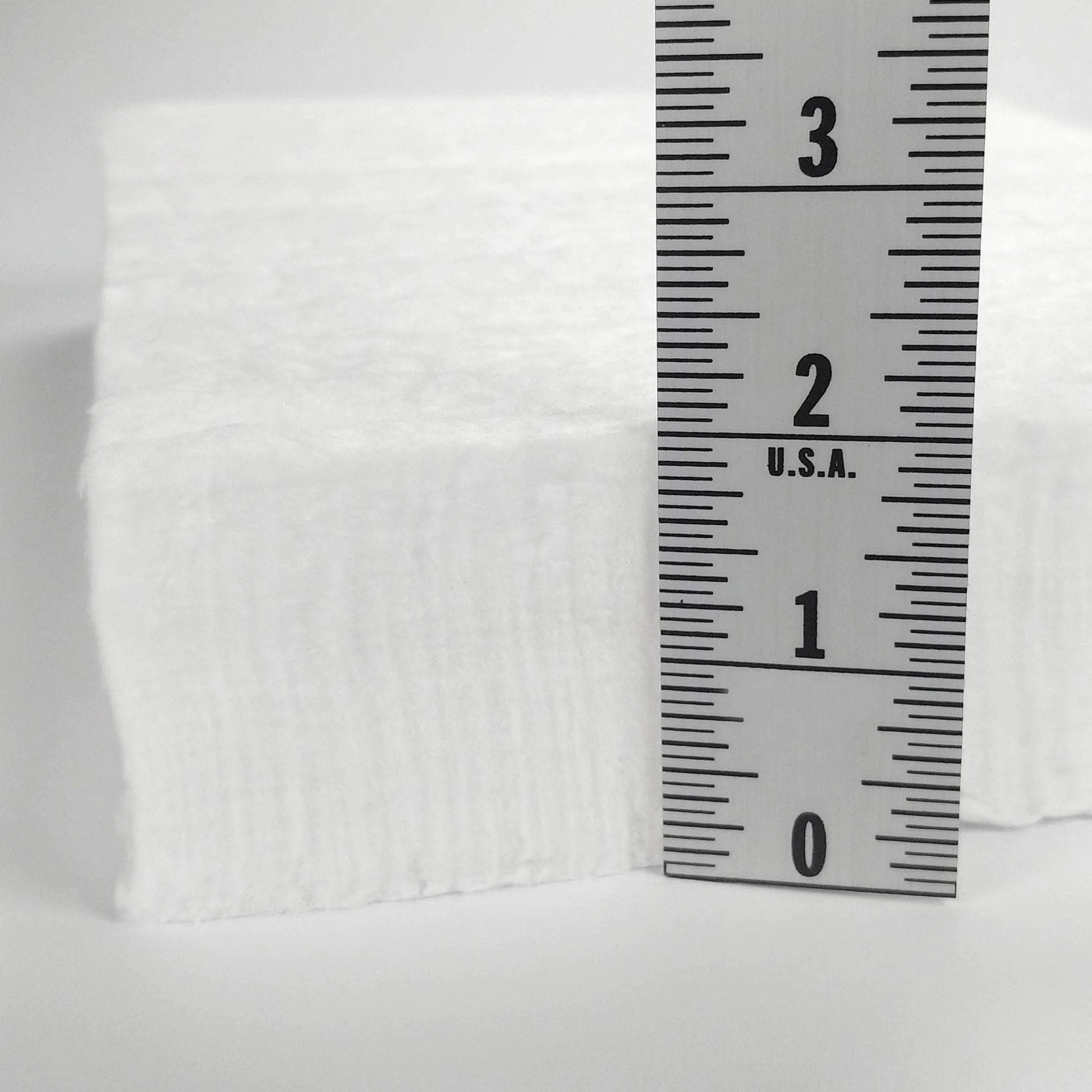 Side view of Heavy Duty Ceramic Fiber Insulation Blanket 2 Inch Thick By 15 By 24 In 2400 F Fireproof Heat Shield next to ruler