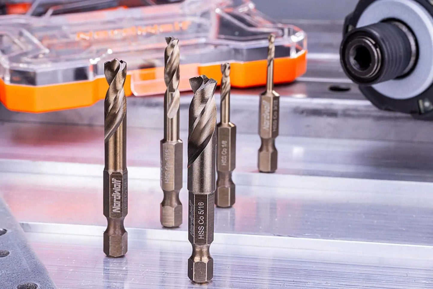 Five-Piece M35 Cobalt Stubby Drill Bit Set For Stainless Steel And Other Hard Metals With One Quarter Inch Hex Shank For Quick Change Chucks And Impact Drivers In SAE Sizes Three Thirty-Seconds One Eighth Three Sixteenths One Quarter Five Sixteenths In arranged on a metal surface