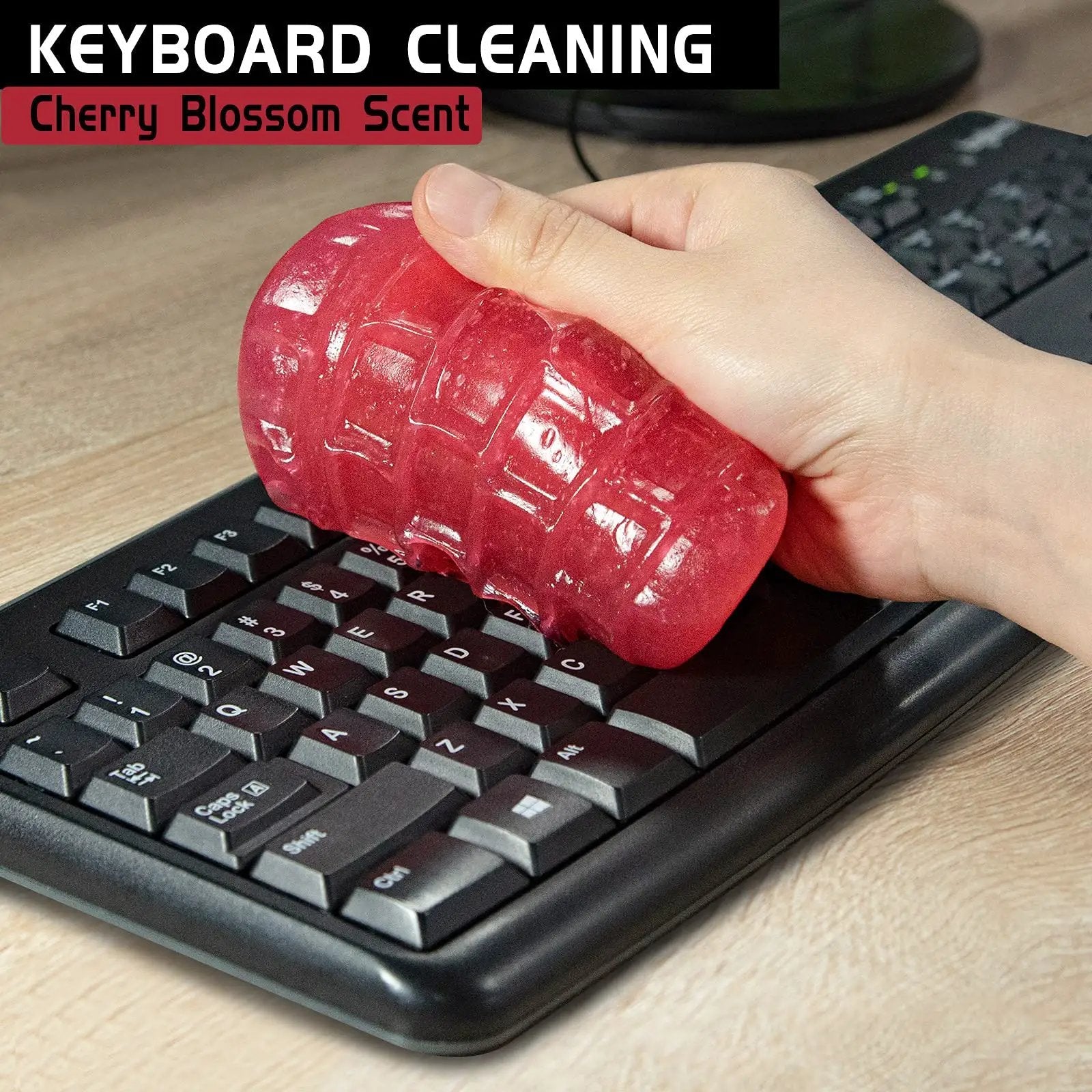 Close-up of Rose Red Car Cleaning Gel Putty For Detailing And Interior Cleaning Reusable Slime on a keyboard.