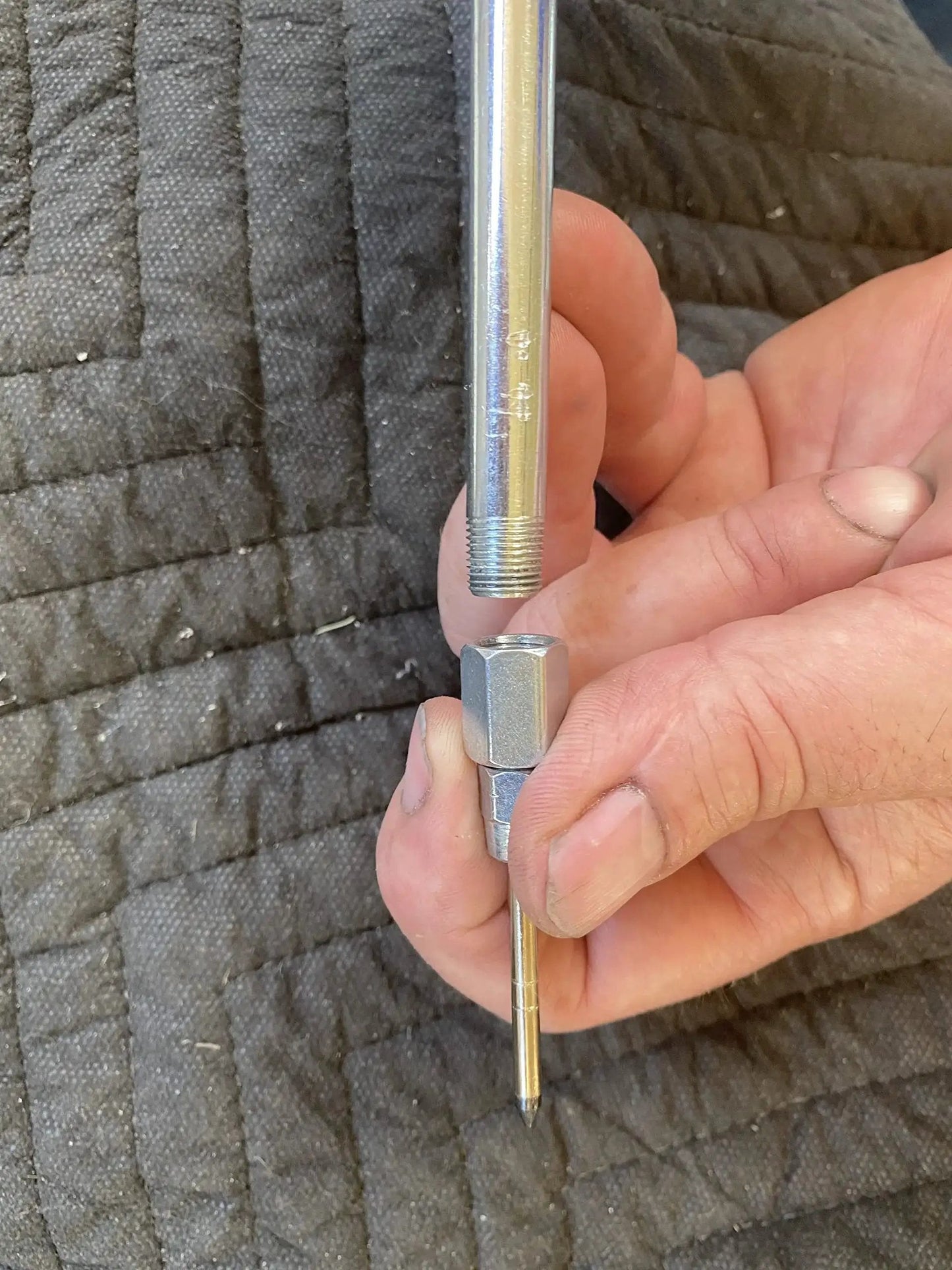 Needle Nozzle Accessory For Handheld Grease Guns With Hardened Steel Tip 1/8 Inch Female NPT, 2.76 Inch Length held by hand