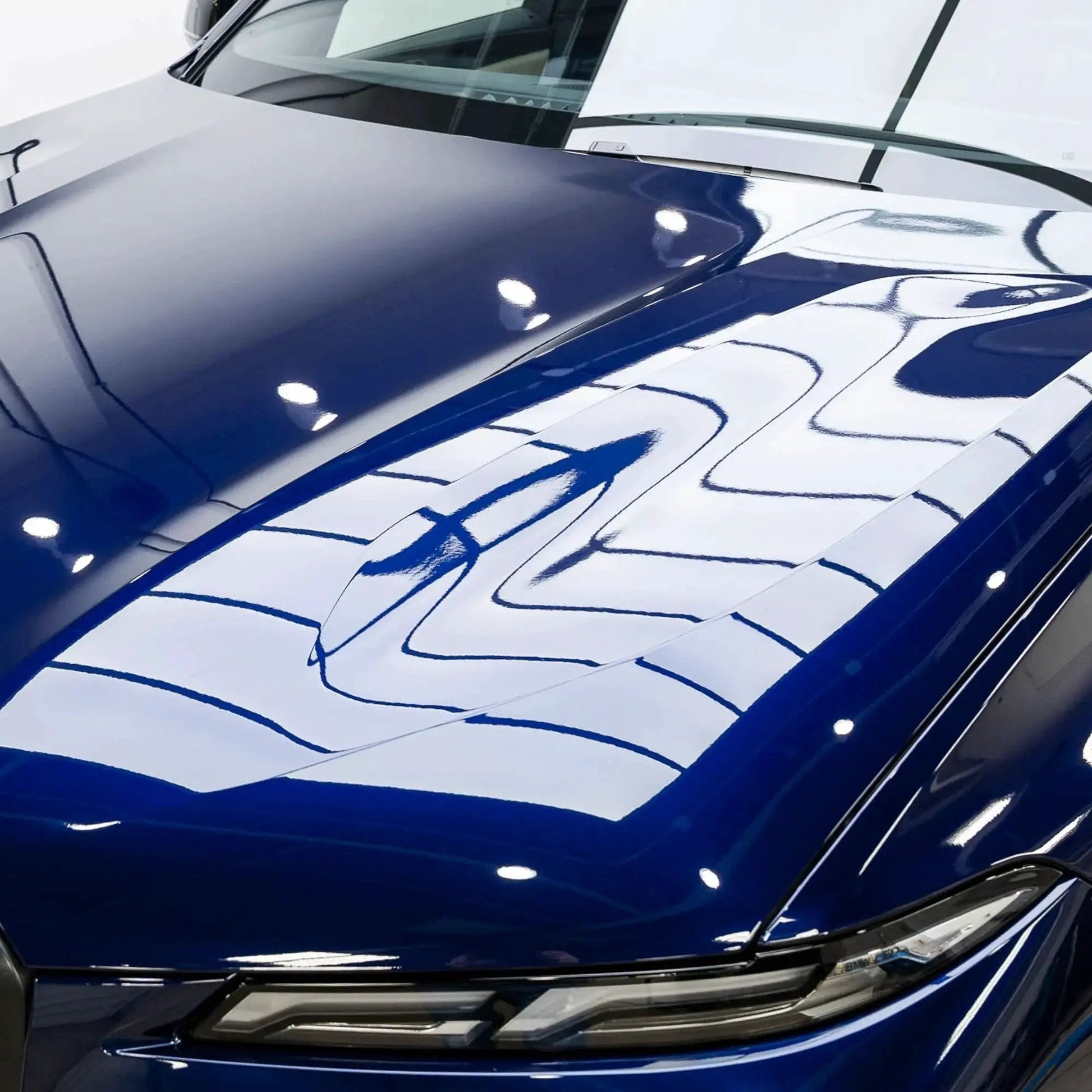 Shiny car hood demonstrating Gyeon Mohs Ceramic Coating Kit For Cars DIY Deep Gloss And 3 Year Protection application effect